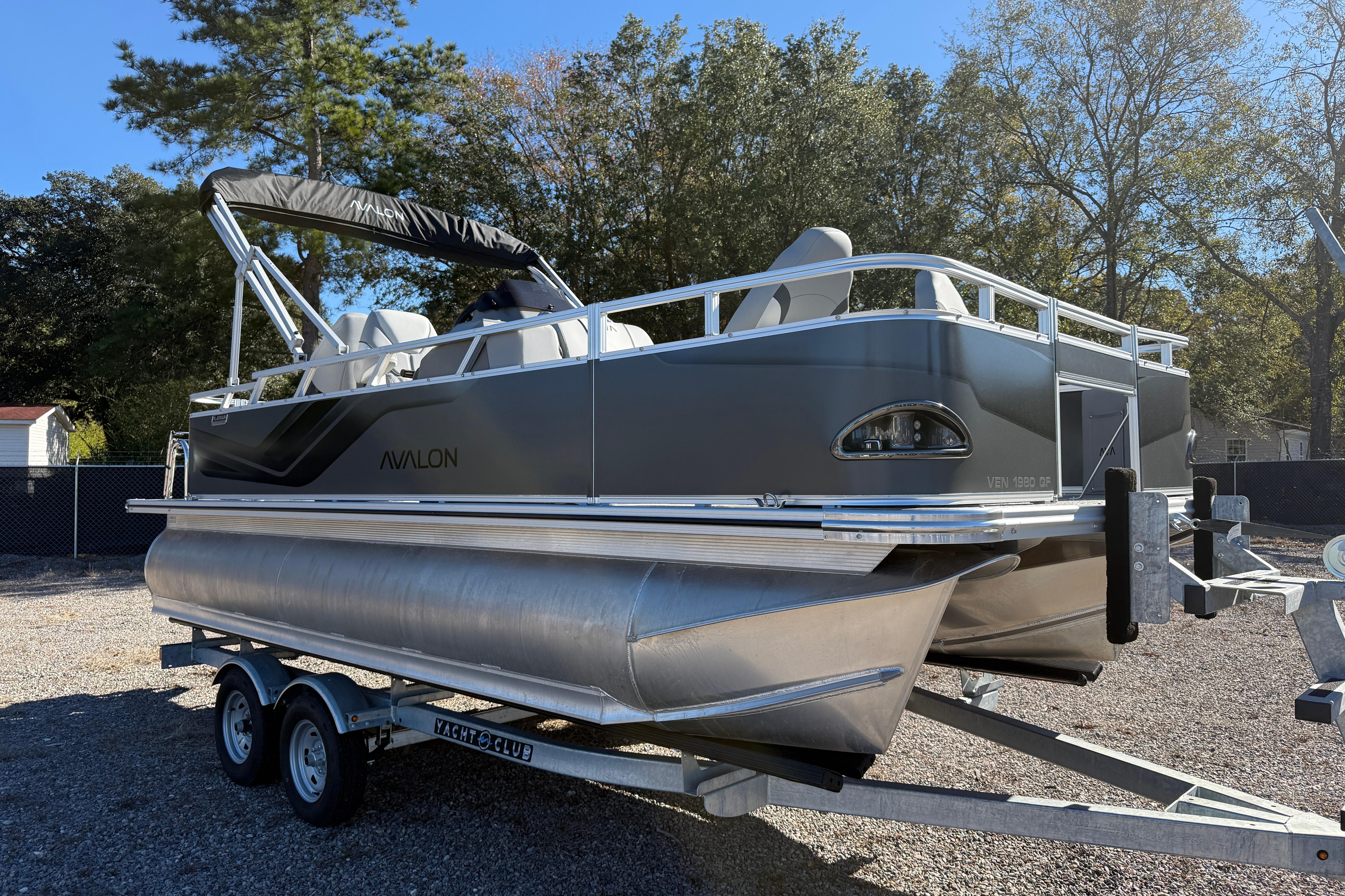 Avalon VENTURE 85 QUAD 2026 pontoon boat on trailer, parked outdoors.