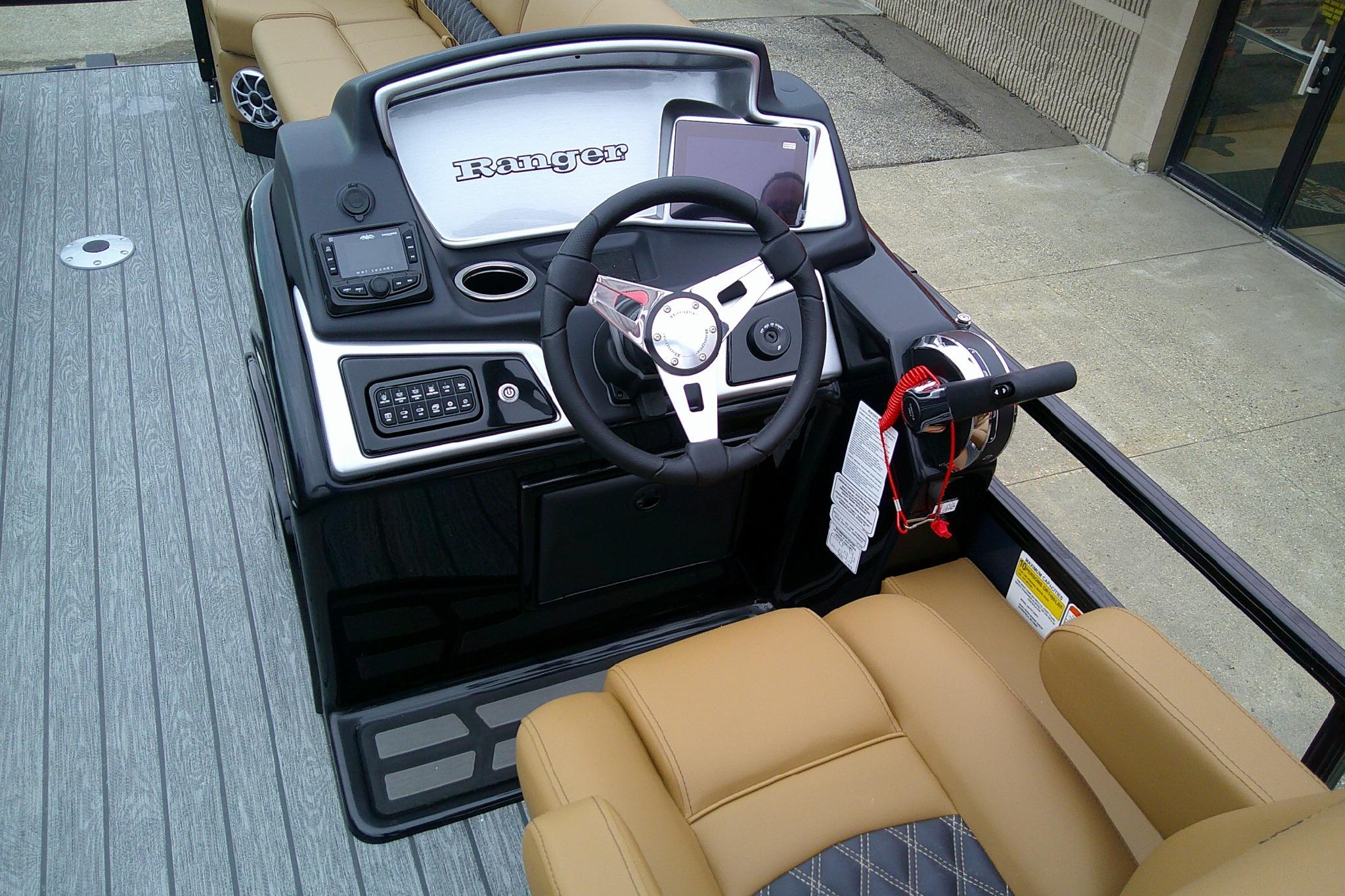 2026 Ranger 220FC boat dashboard with steering wheel and control panel.