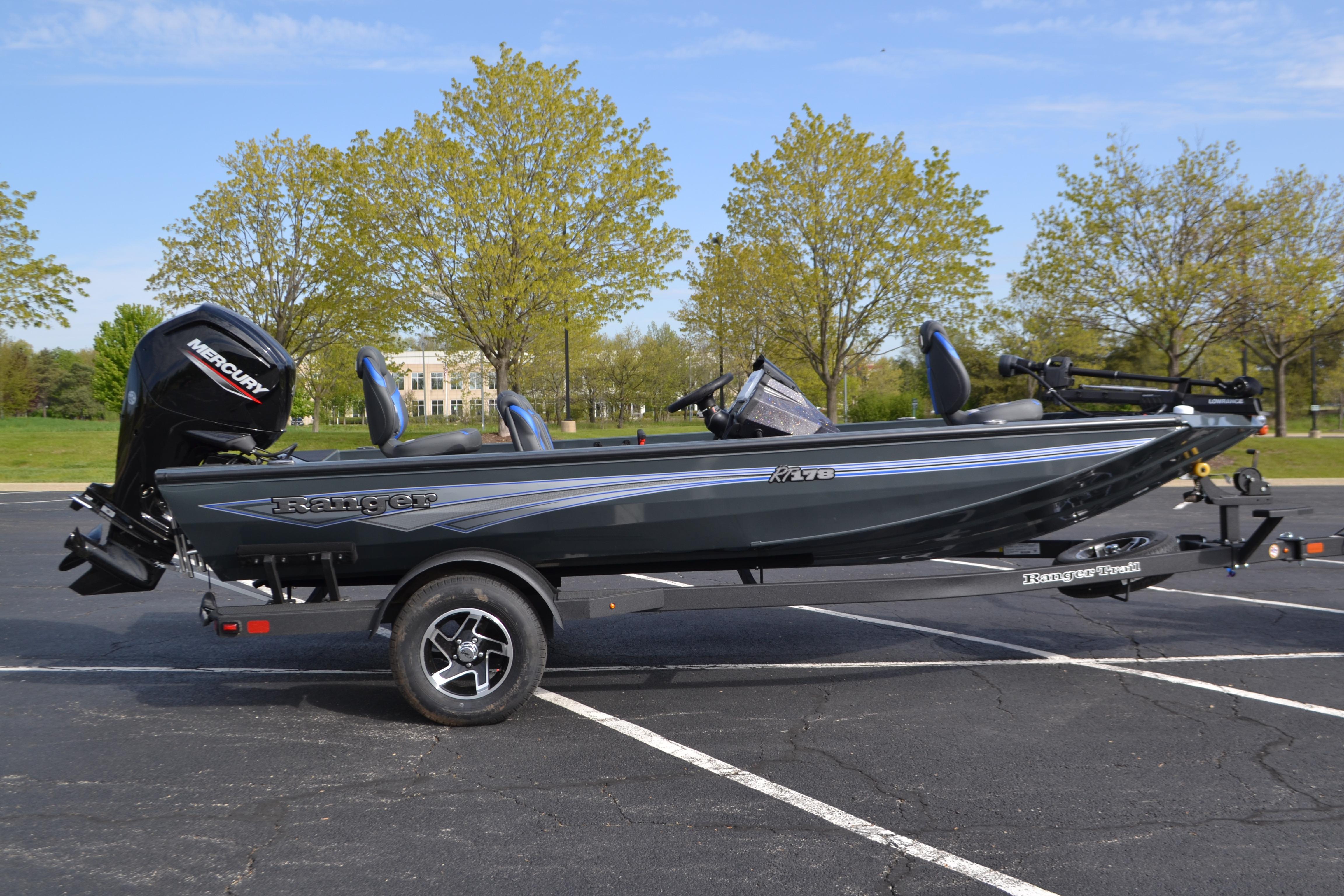 2026 Ranger RT178 boat on trailer in parking lot, featuring Mercury engine.