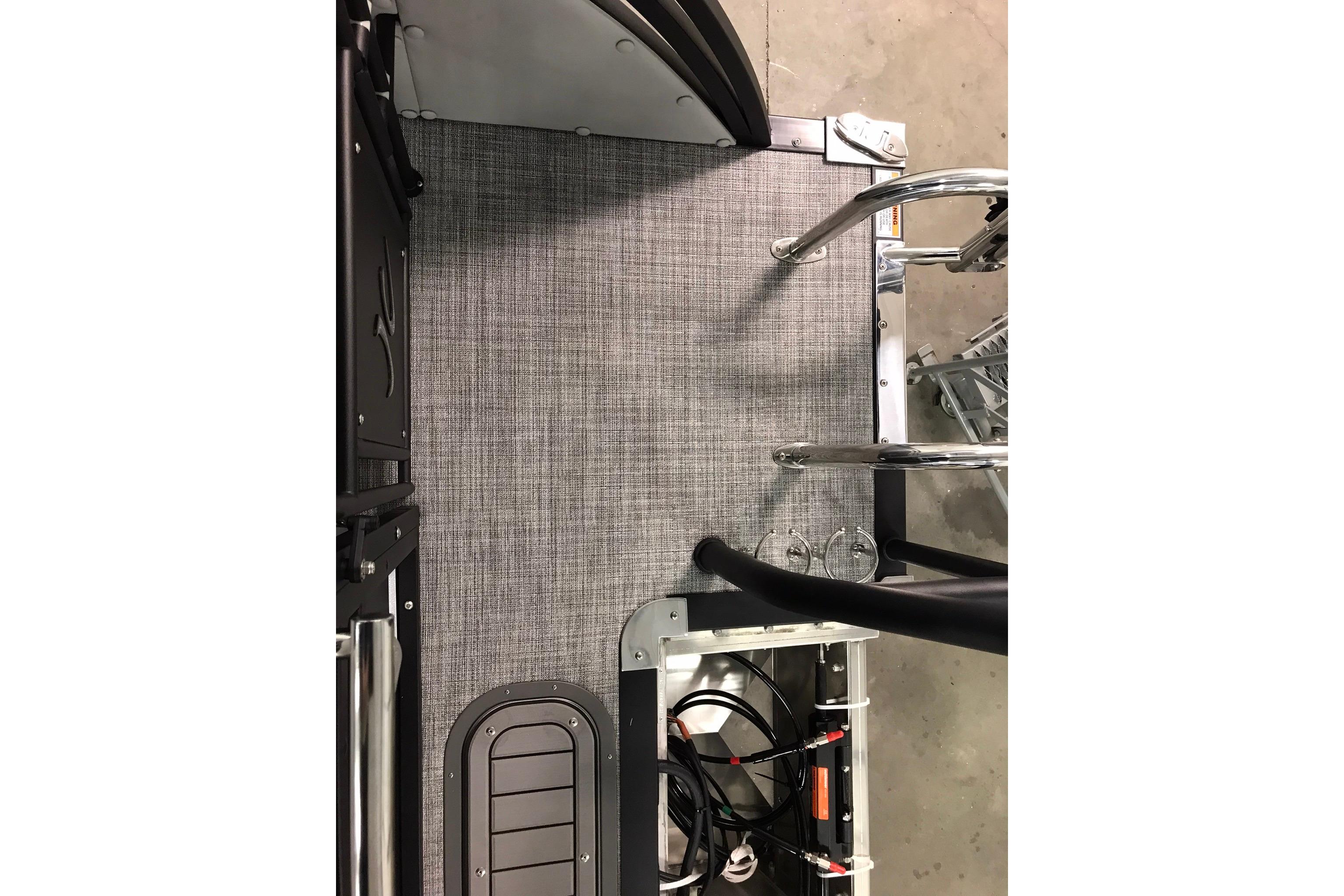 2026 JC NEPTOON SPORT 21TT boat interior with gray flooring and metal fixtures.