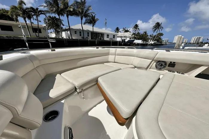 2019 Boston Whaler 350 Realm boat interior with luxurious seating and waterfront view.