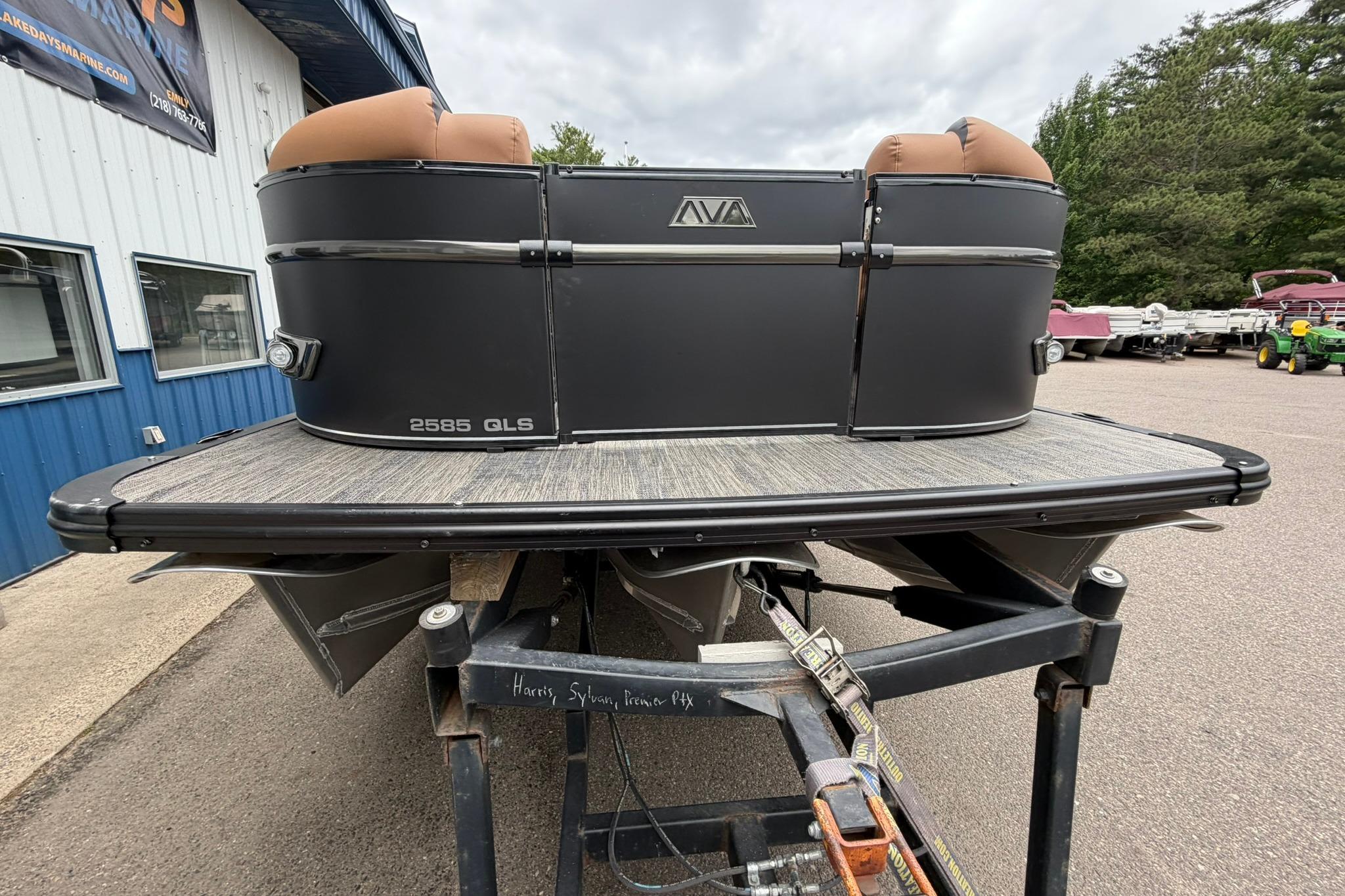 2026 Avalon Catalina Quad Lounge Shift boat on trailer, outdoor setting.