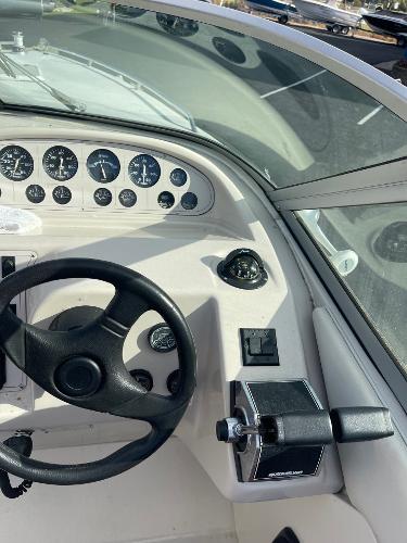 1992 Regal Ventura boat dashboard with steering wheel and control panel.