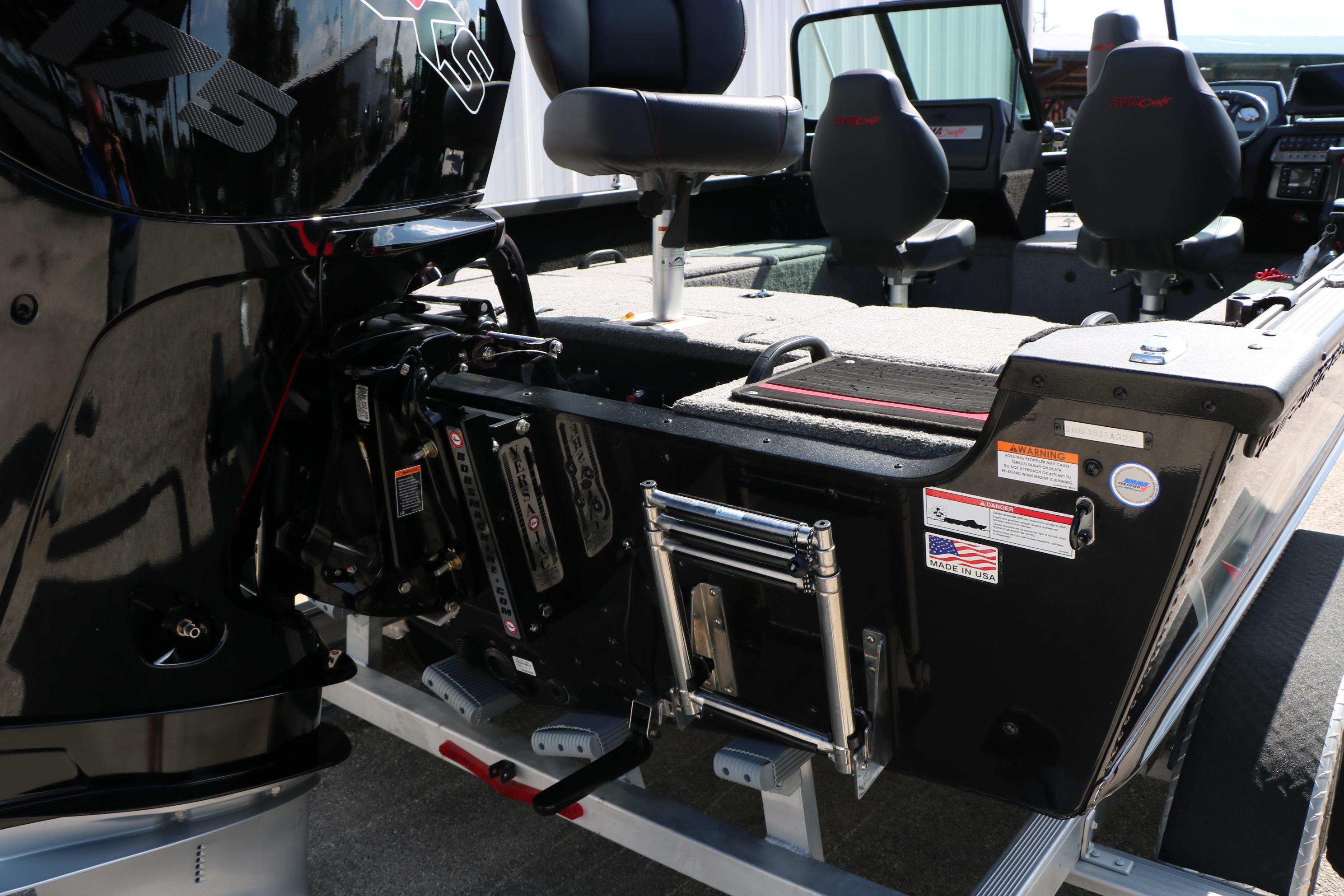 2023 Alumacraft Competitor FSX 185 boat interior with seating and motor details.