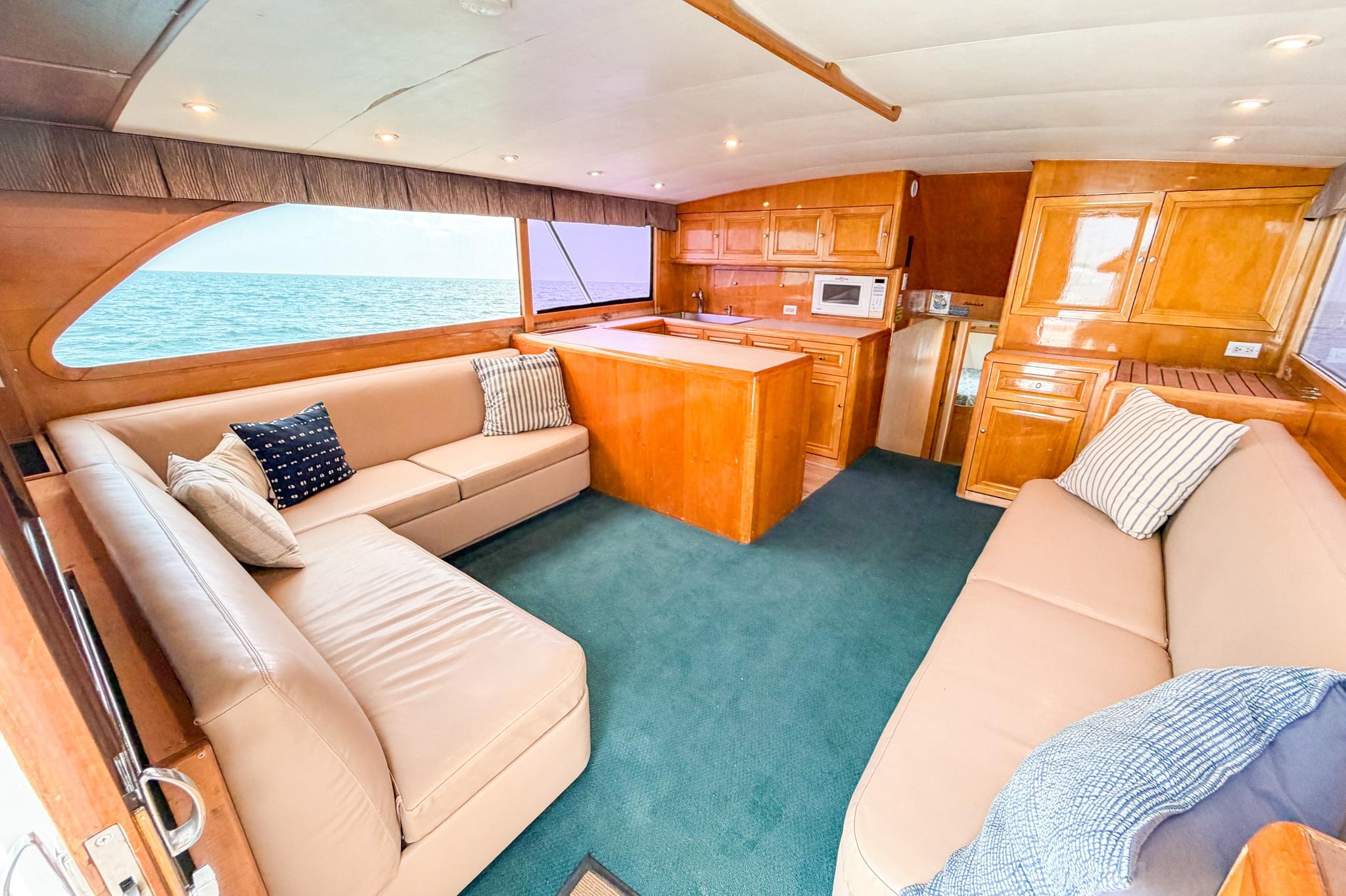 Interior of 1998 Blackwell Custom Carolina Sportfish with cozy seating and ocean view.