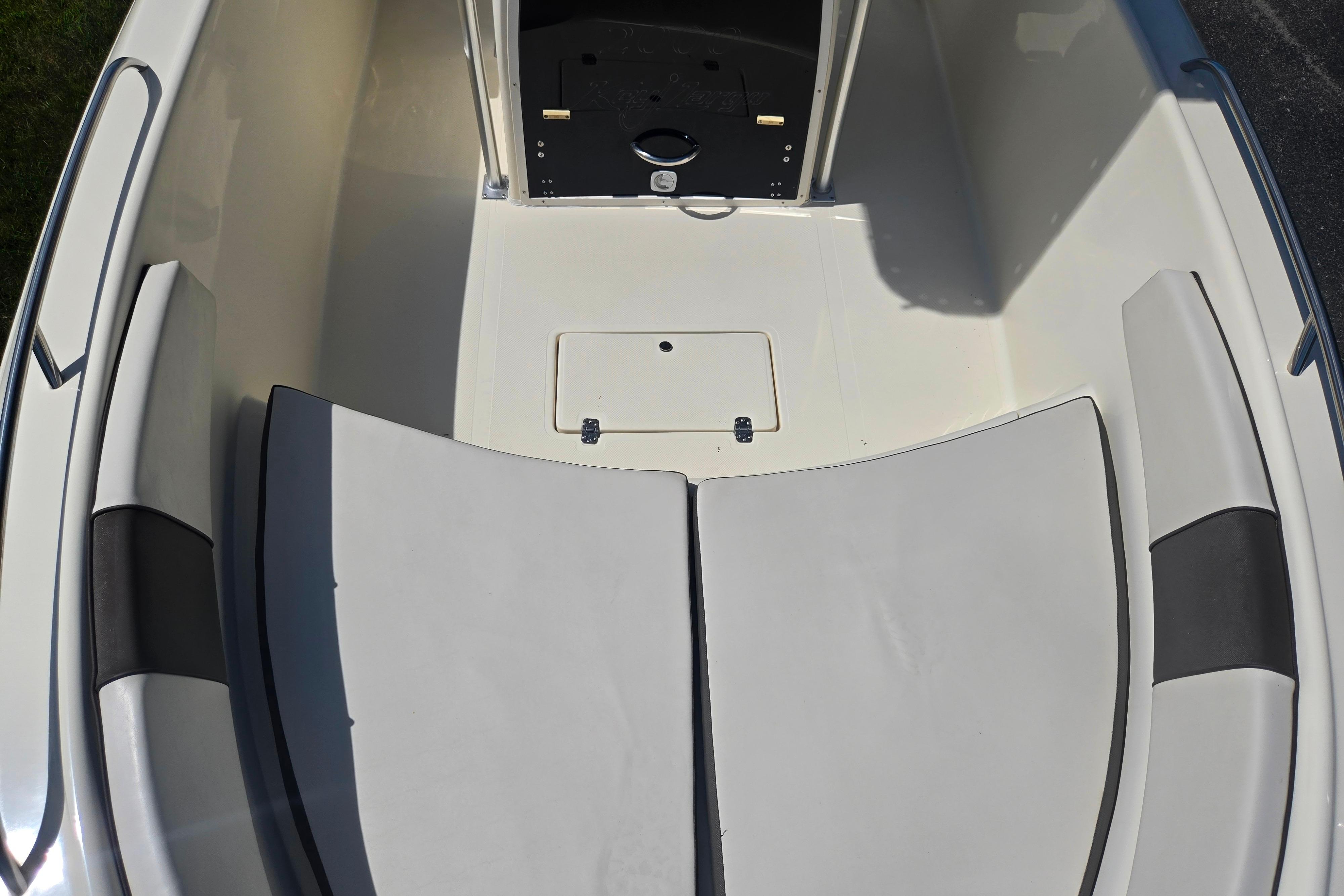 Interior view of a 2016 Key Largo 2000CC boat with cushioned seating.