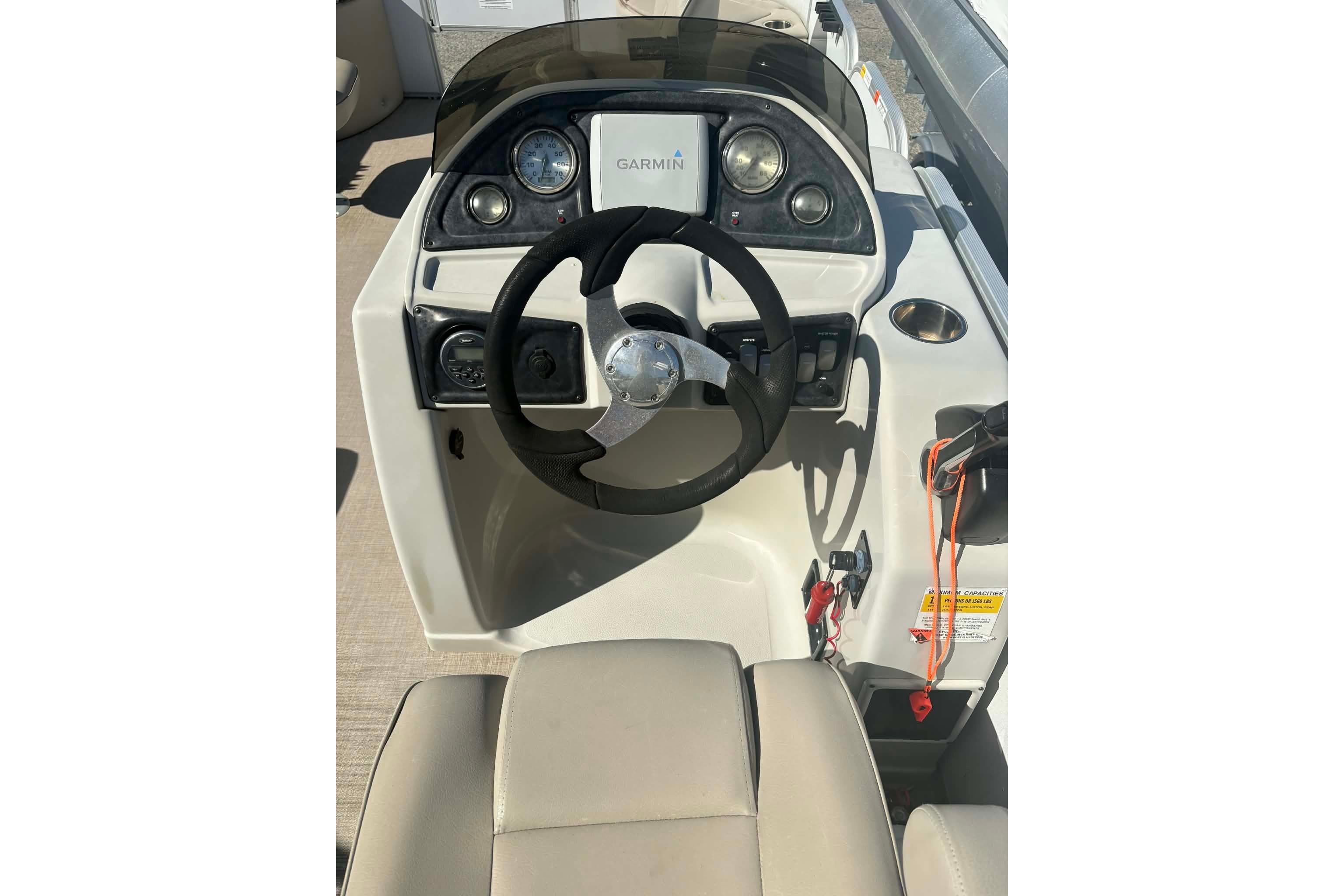 2017 G3 boat console with Garmin GPS, steering wheel, and control panel.