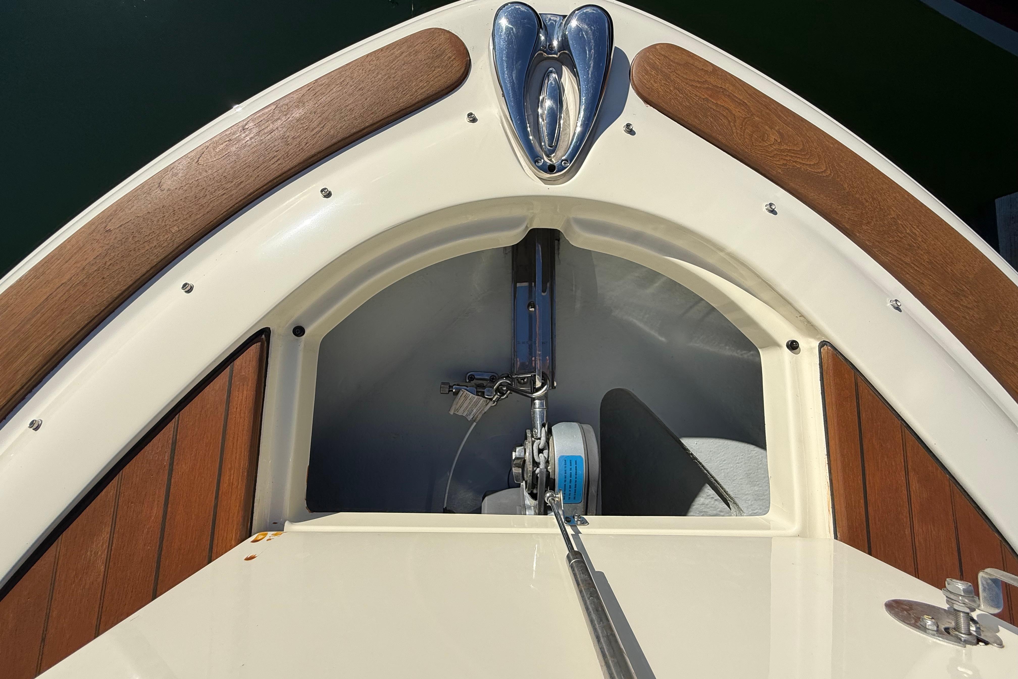 2018 Chris-Craft Launch 30 boat bow with wood accents and anchor storage.