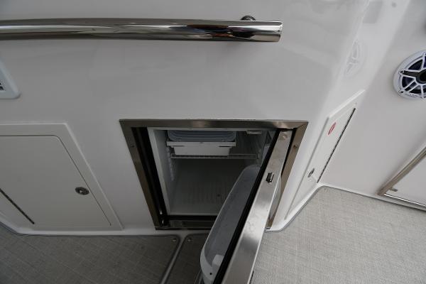 Open storage compartment on 2021 Regal 35 Sport Coupe boat interior.