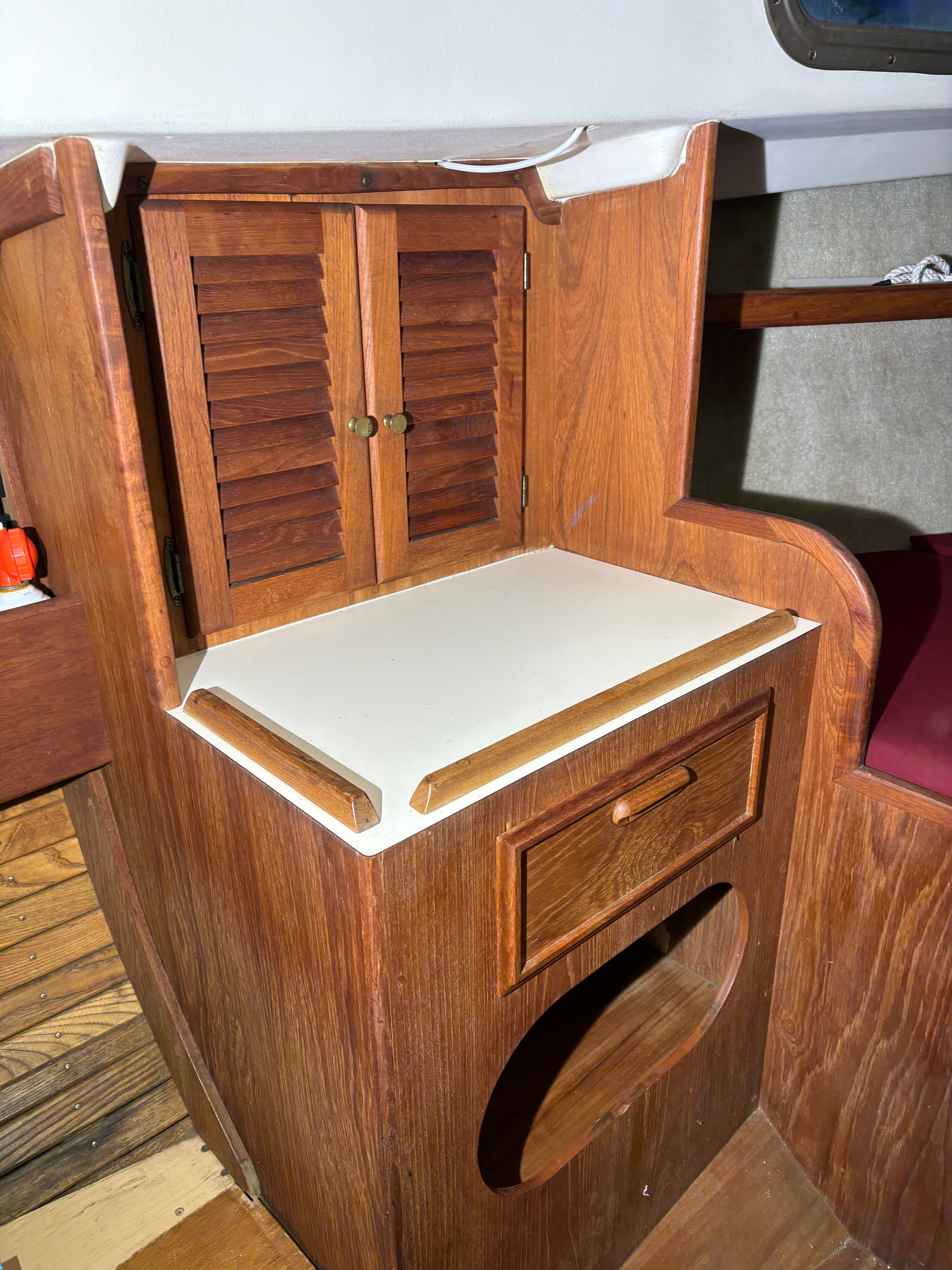Interior of a 1986 Cape Dory 26 yacht with wooden cabinetry.