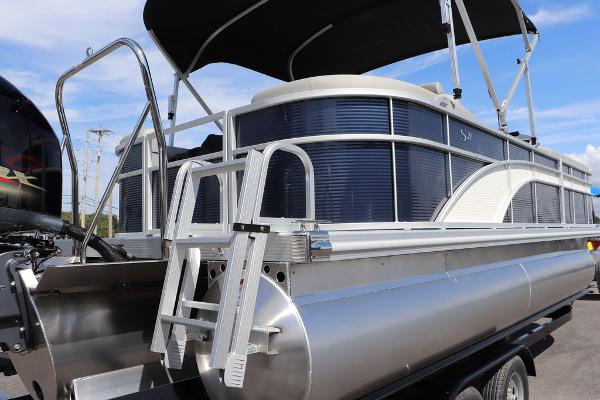 2024 Bennington 21 SSR pontoon boat with ladder and canopy.