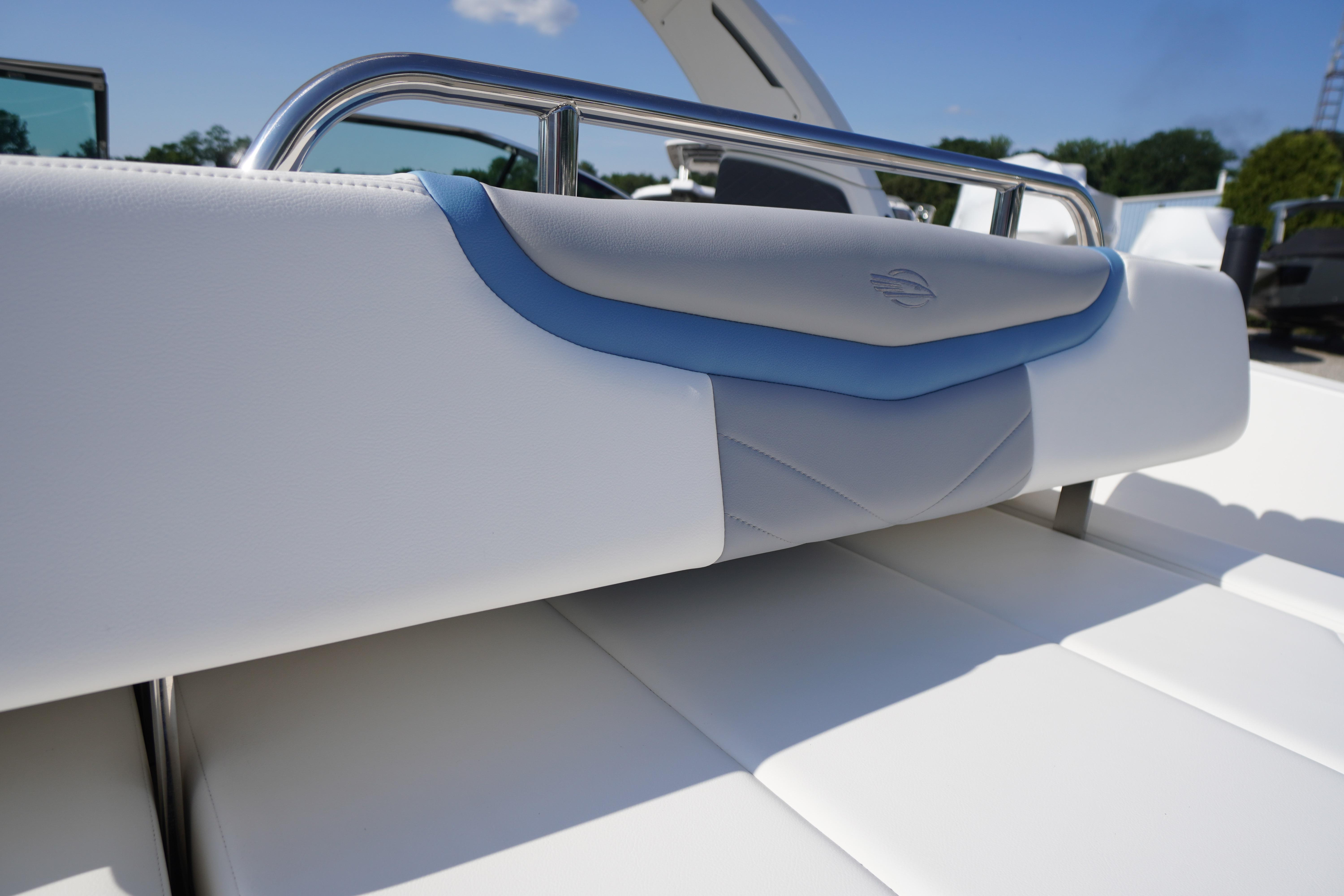 2026 Chaparral 270 OSX boat seat with sleek white and blue design.