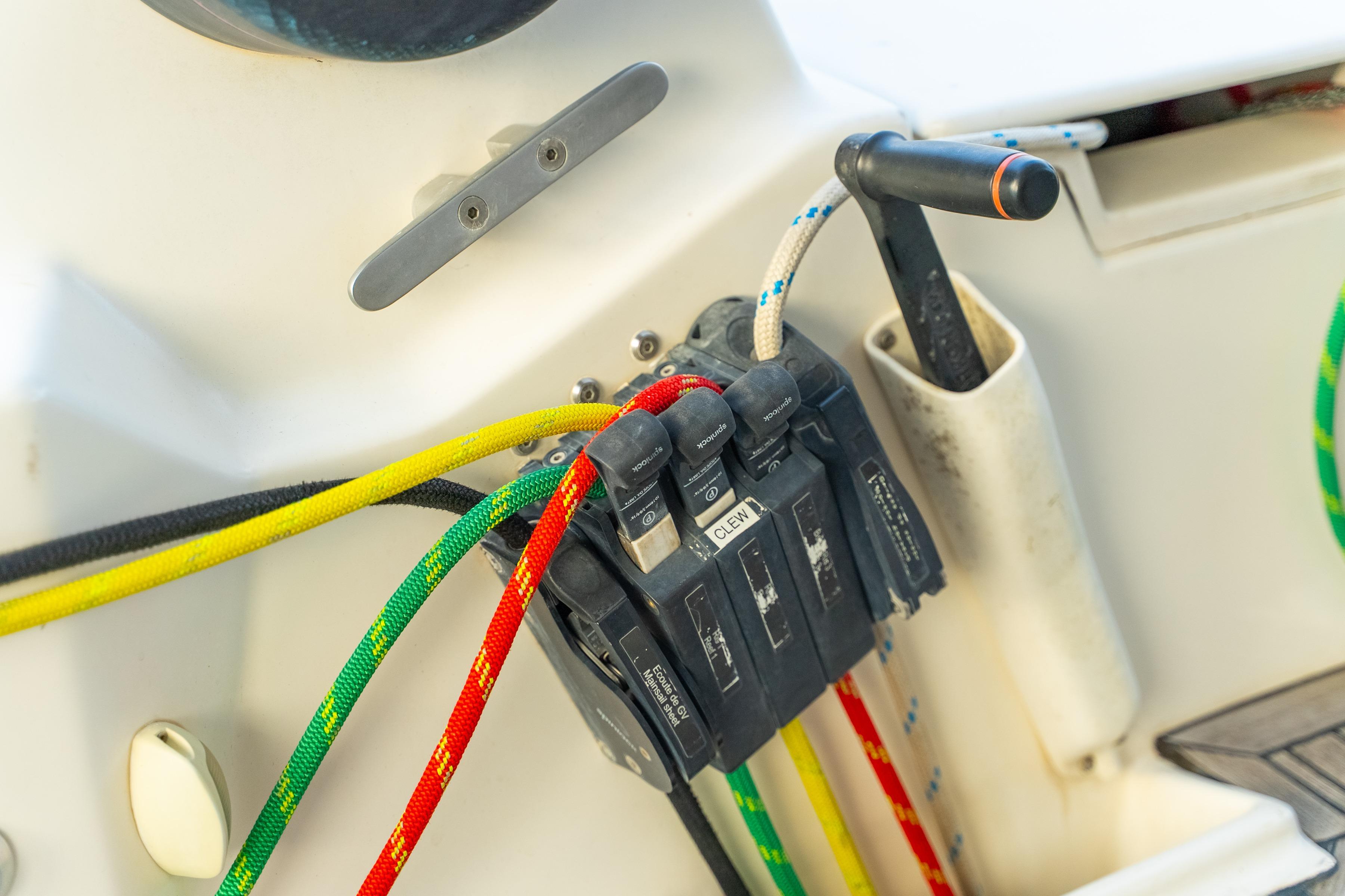 Colorful ropes and cleats on a 2009 Catana 65 sailboat deck.