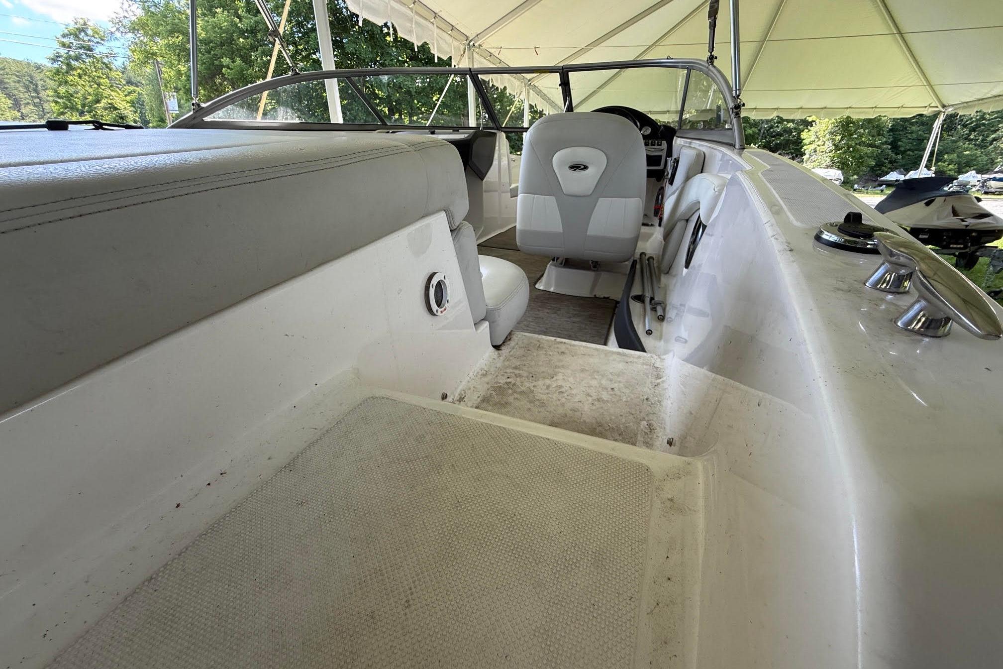 2016 Regal 1900 ES Bowrider interior under canopy, showcasing seating and helm.