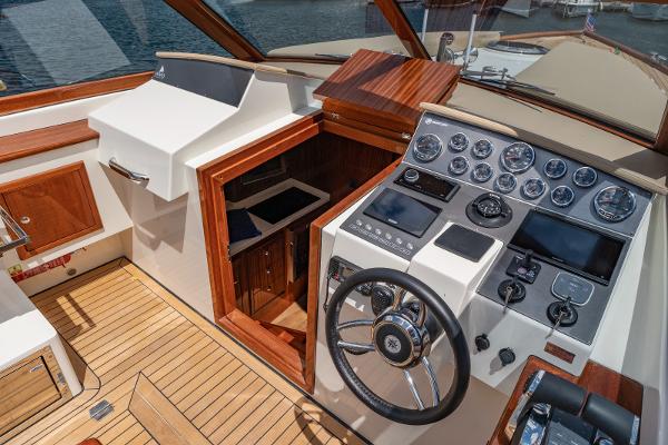 Cockpit of 2023 Vento V40 Retro Classic Open boat with wooden accents and modern controls.