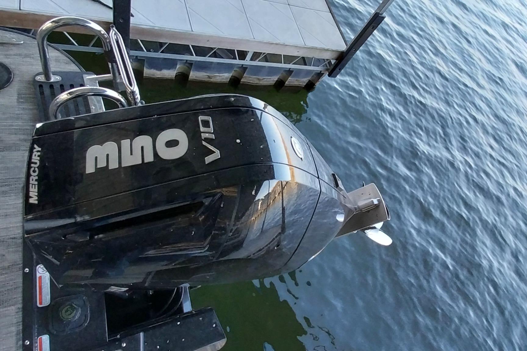2023 Ranger 2500LS boat with Mercury V10 outboard engine at dockside.