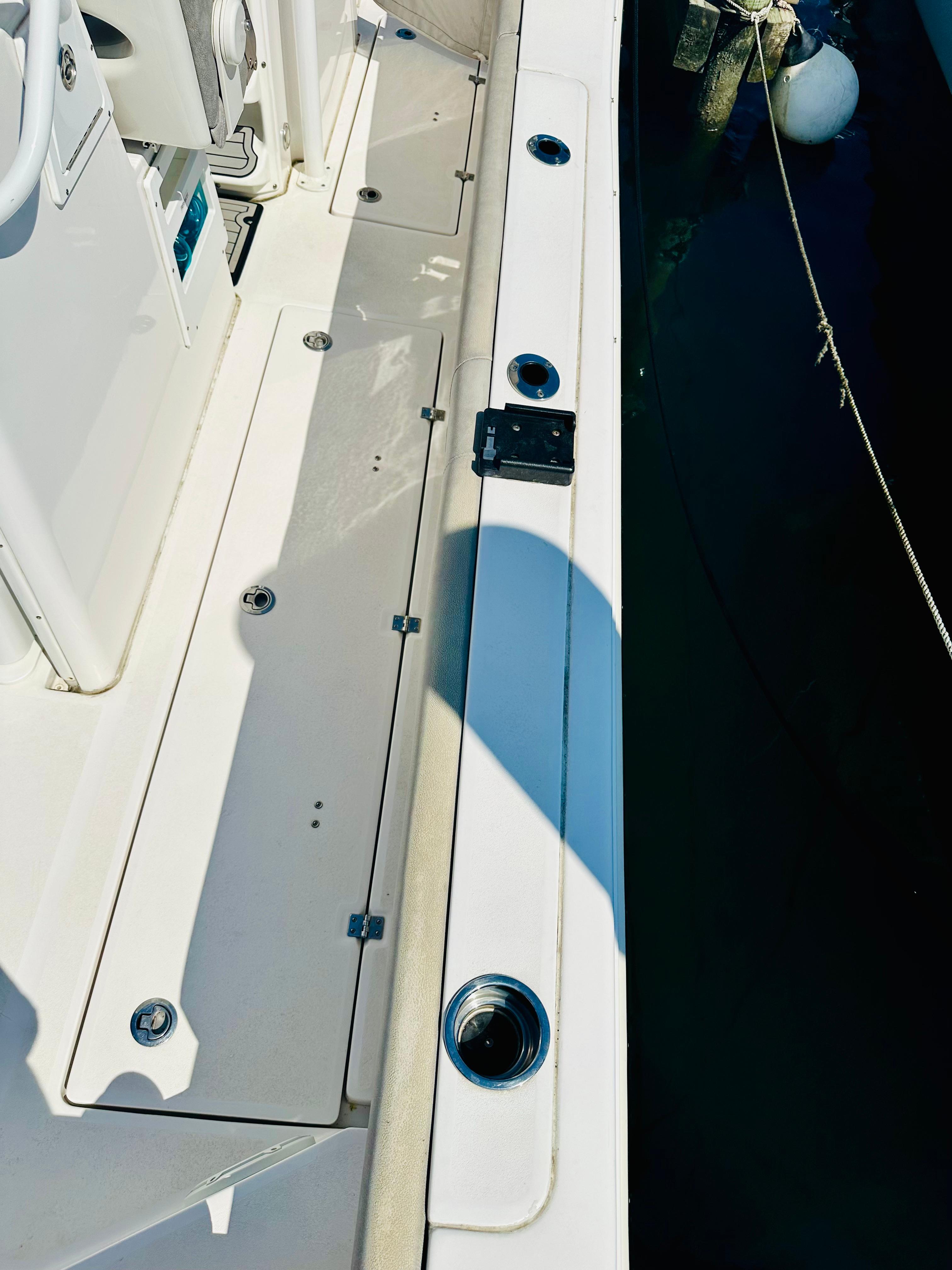2019 Sea Fox 328 Commander boat deck with rod holders and clean design.