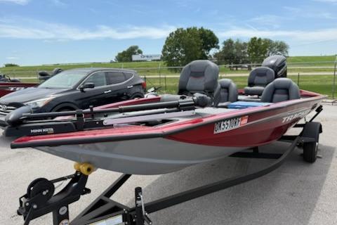 2024 Tracker Pro Team 175 TXW boat on trailer, parked outdoors.