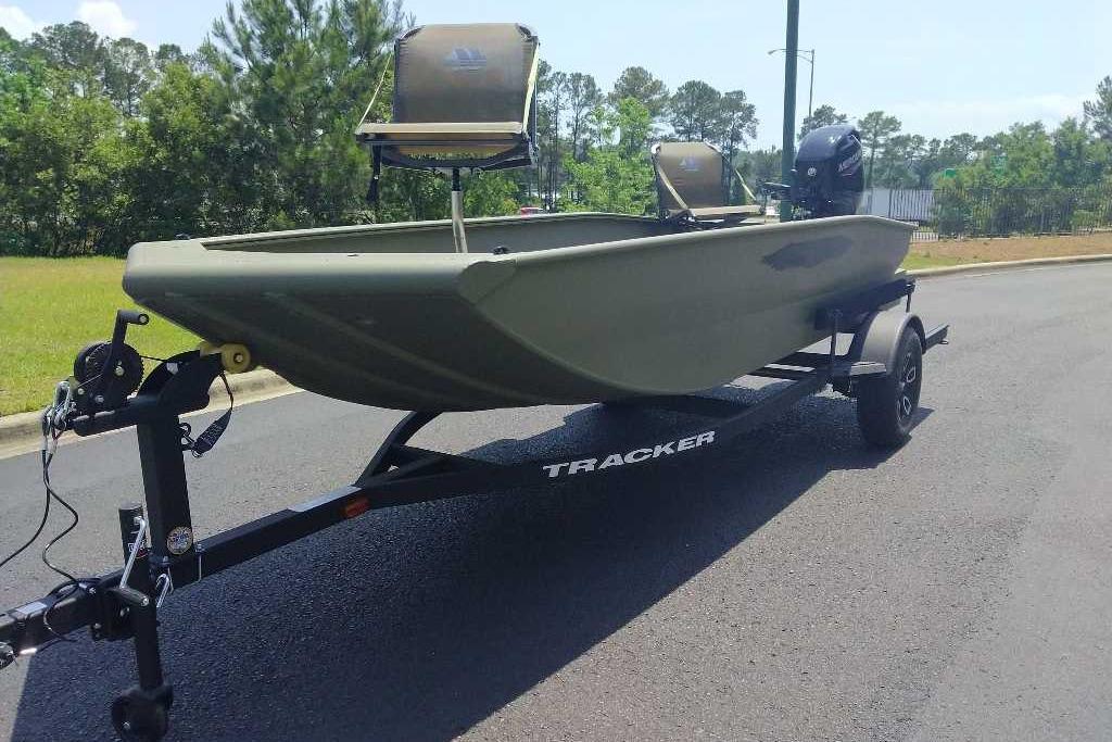 2026 Tracker Grizzly 1650 T Prairie Wings Edition boat on trailer, parked on road.