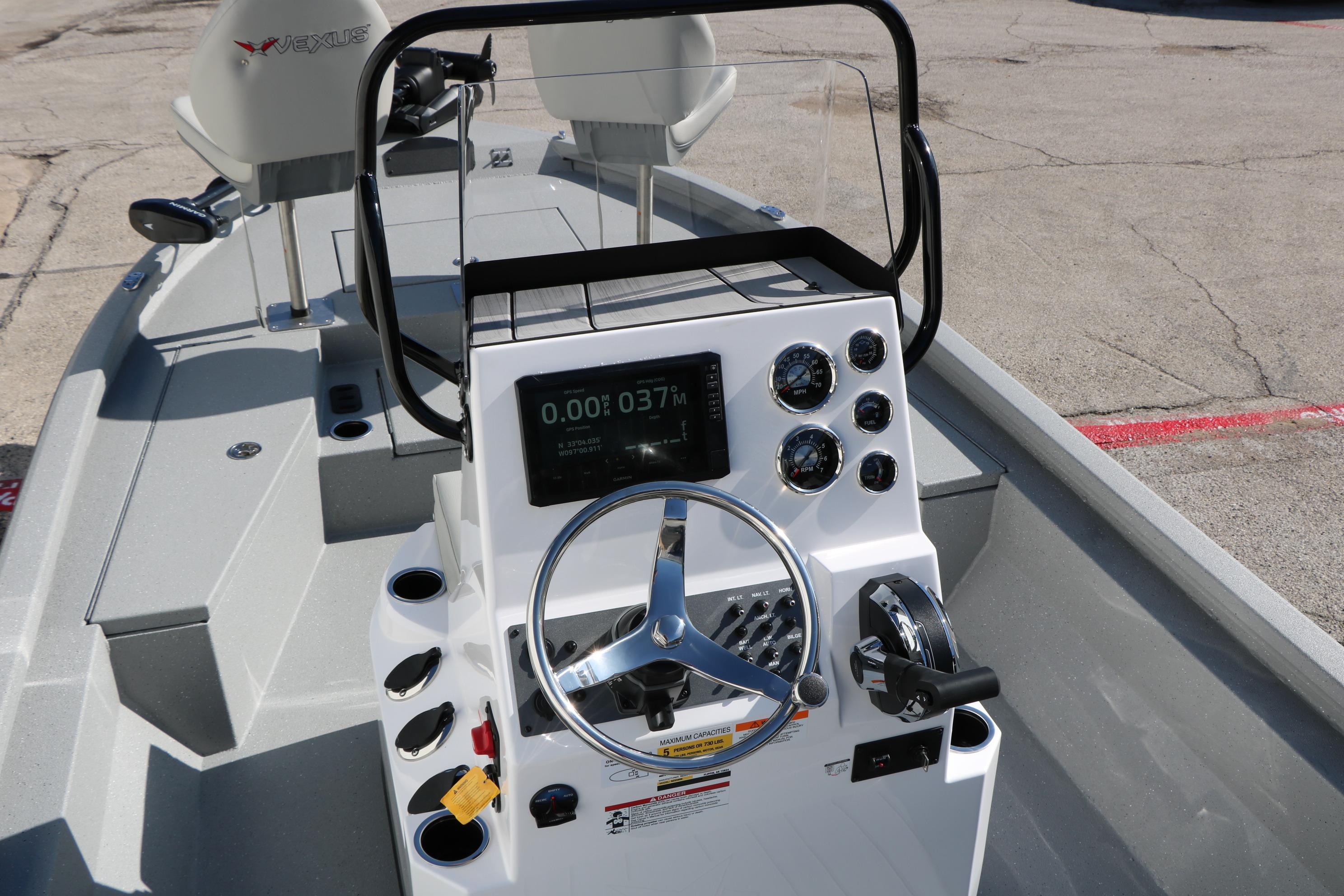 2026 Vexus ACX2000 boat console with steering wheel and control panel.