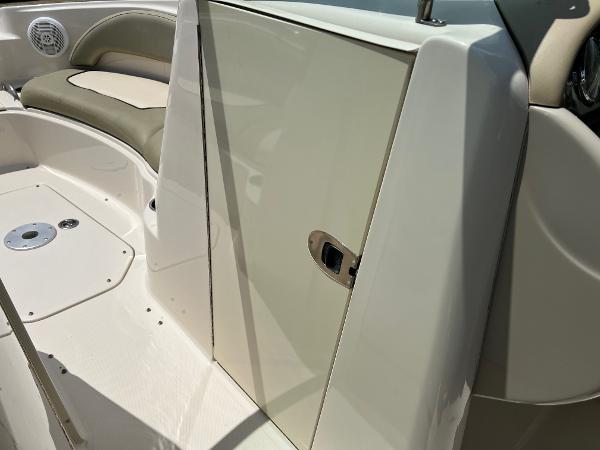 2005 Sea Ray 220 Sundeck interior with seating and storage compartment.