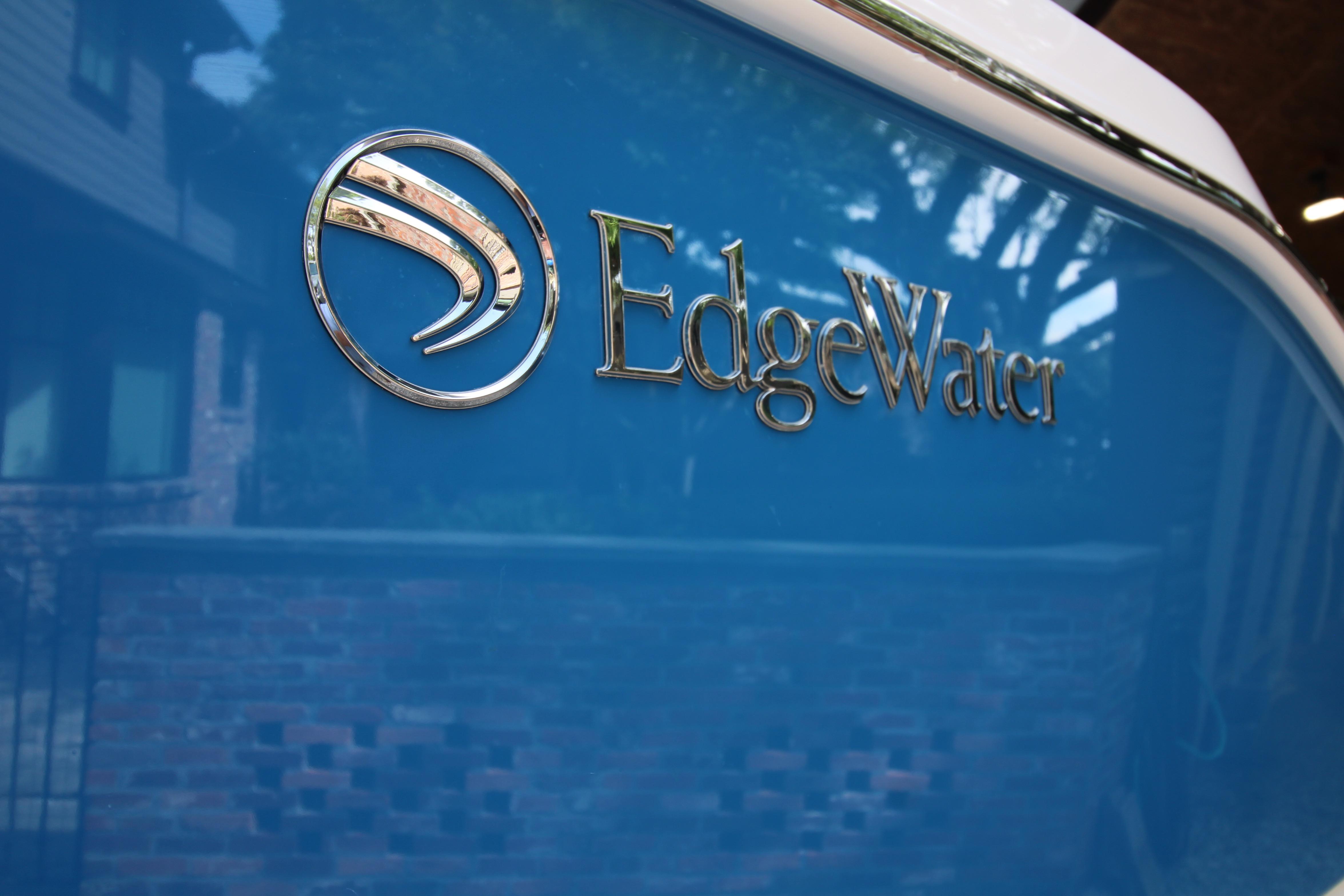 Edgewater 280CC 2022 boat logo on a glossy blue surface.