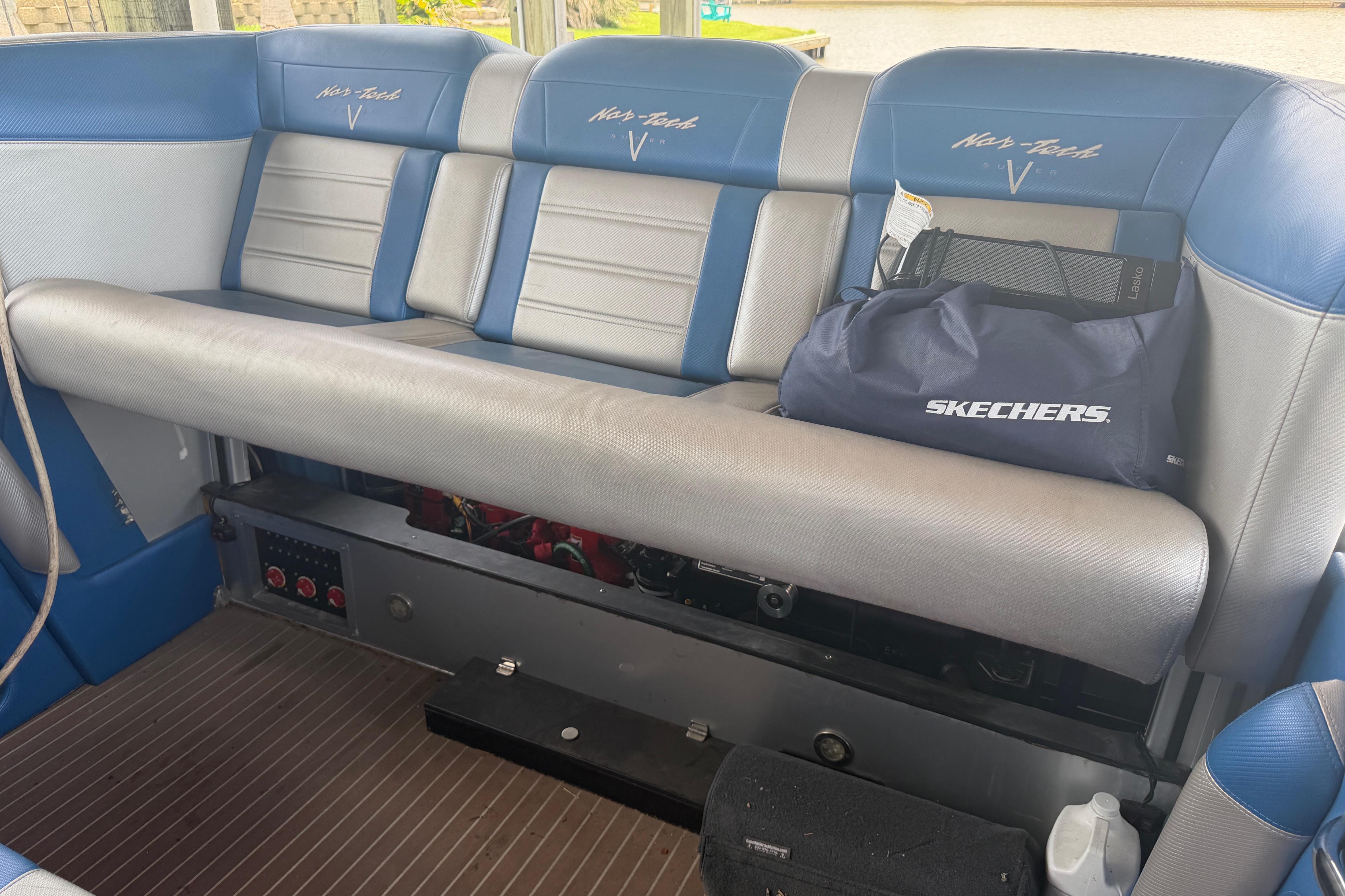 Interior of 2013 Nor-Tech 477 SPX Vee Bottom boat with blue and gray seating.
