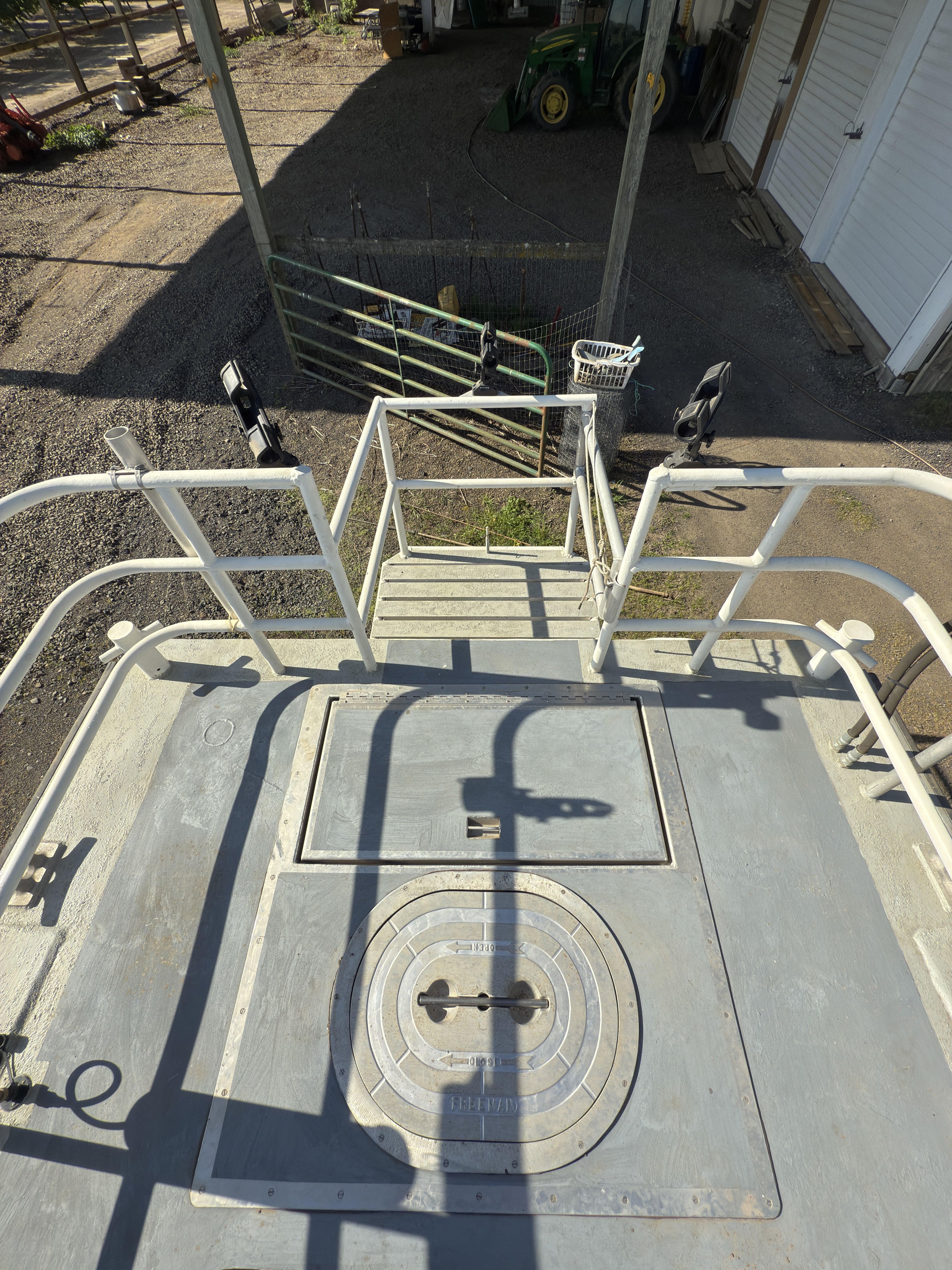 1975 Monark 30 Fishing Boat deck with railing and hatch, viewed from above.
