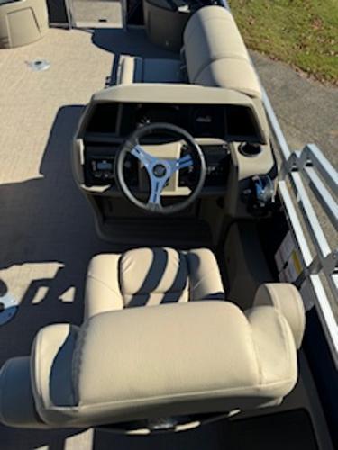 Interior of 2025 Sun Tracker Fishin' Barge 22 DLX with steering console.