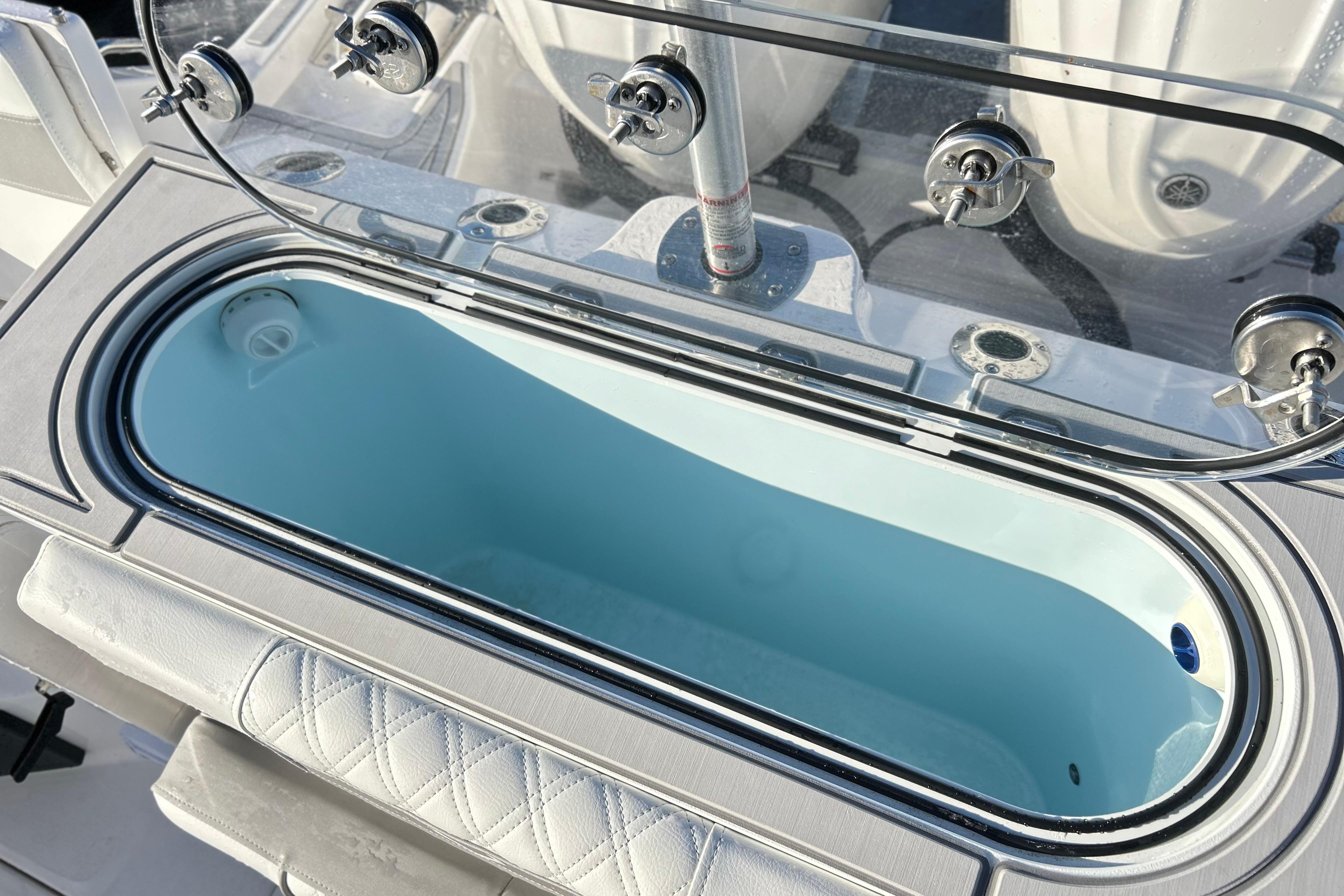 Livewell on 2026 Sea Fox 288 Commander boat, featuring a sleek design and secure lid.