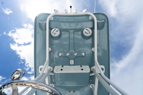 2024 Sea Hunt Ultra 234 boat console against a blue sky.