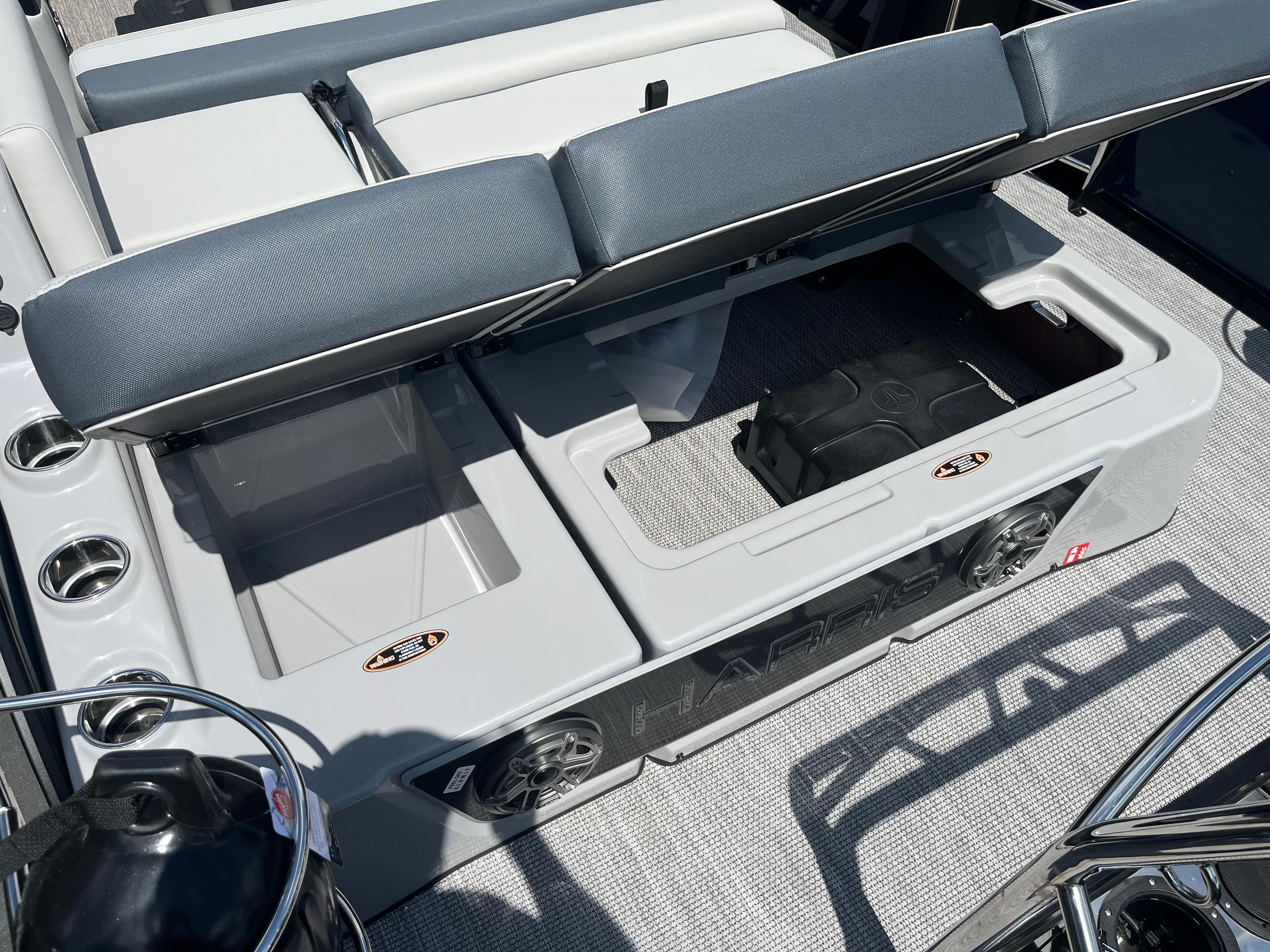 2026 Harris Grand Mariner 230 boat interior with storage compartments and seating.