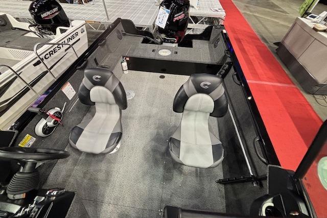 2026 Crestliner 1850 Kodiak WT boat interior with two seats and steering console.