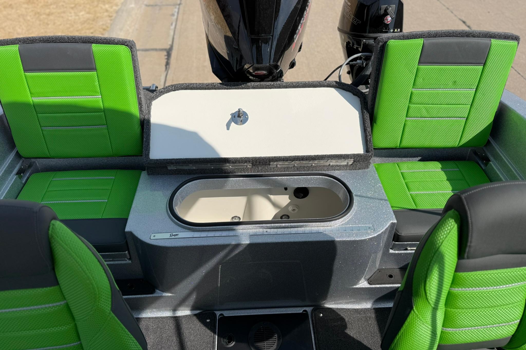 2026 Ranger 1880MS boat interior with green seats and storage compartment.