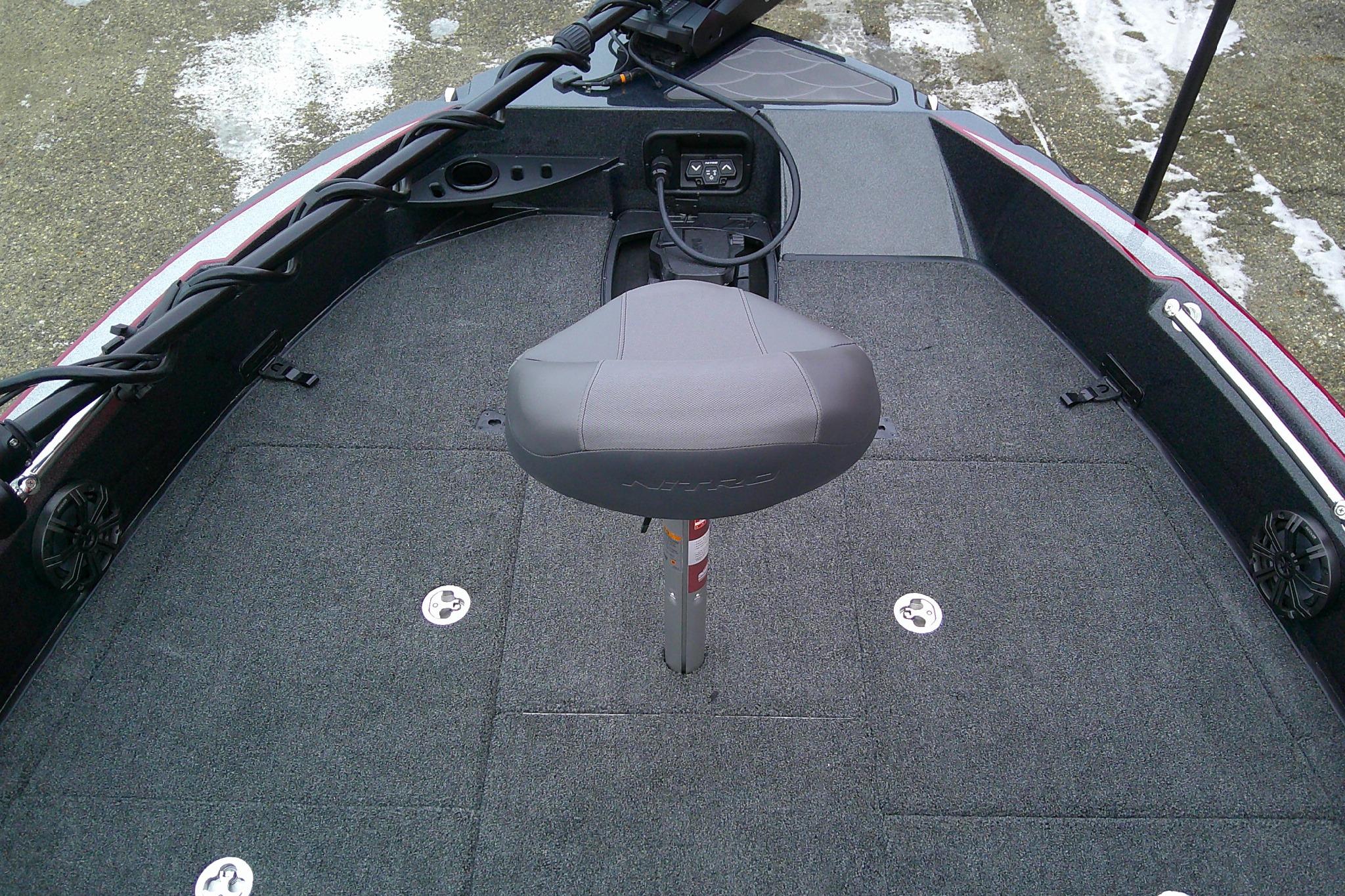 2026 Nitro ZV20 Pro boat interior with gray seating and carpeted deck.