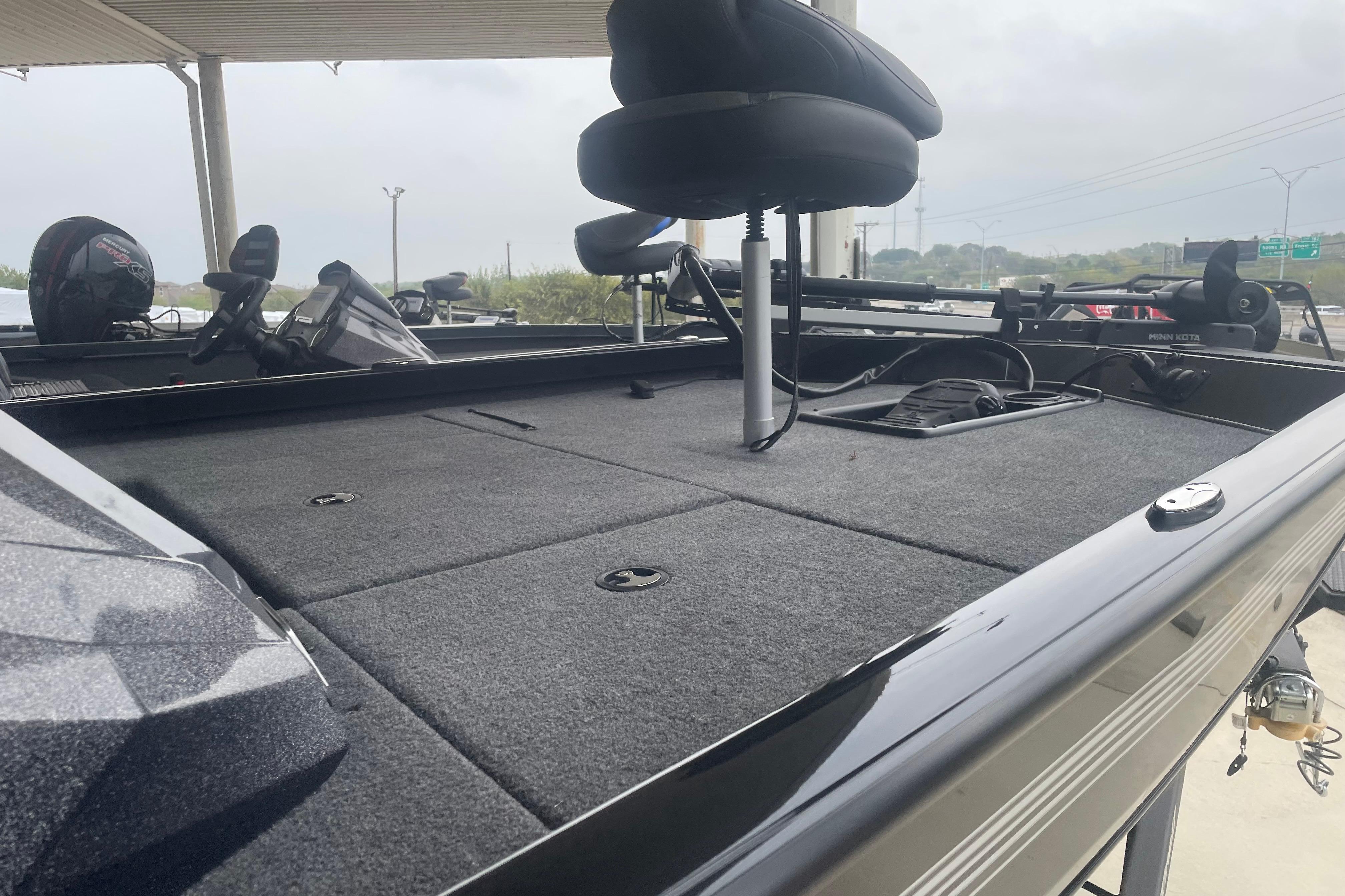 2026 Ranger RT178 boat deck with seating and equipment, under a covered area.