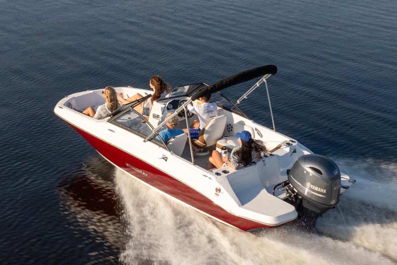 Manufacturer Provided Image: 2026 Stingray 191 DC boat cruising on open water with passengers.