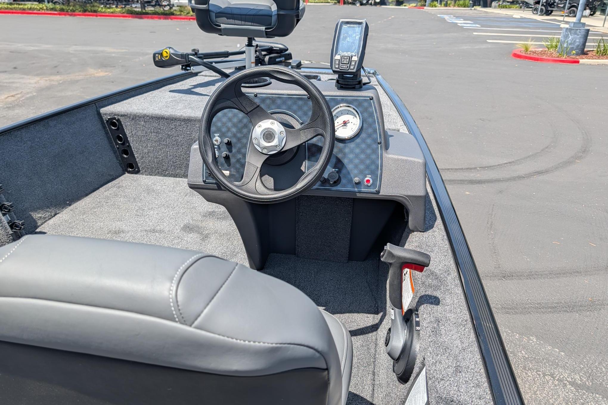 2026 Tracker Bass Tracker Classic XL boat interior with steering wheel and control panel.