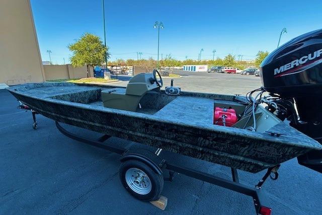 2026 Tracker Grizzly 1648 SC boat on trailer with Mercury outboard motor.