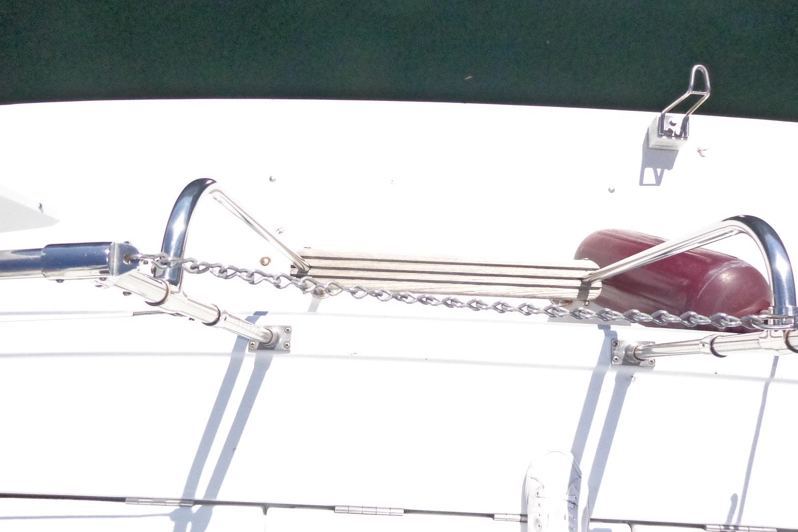 Bow view of 1992 Cruise-A-Home Corsair 4200 with anchor chain and railing.