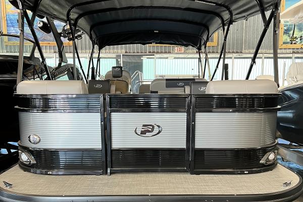 2024 Princecraft Quorum 23 RL pontoon boat with sleek design and spacious seating.