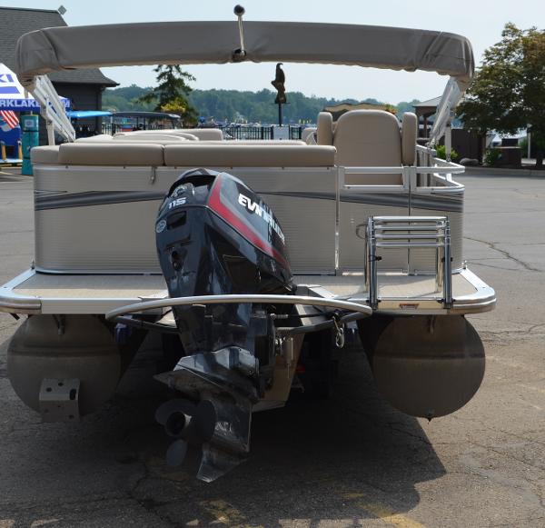 2018 Tahoe LTZ 2285 CR pontoon boat with Evinrude motor, docked in a marina.