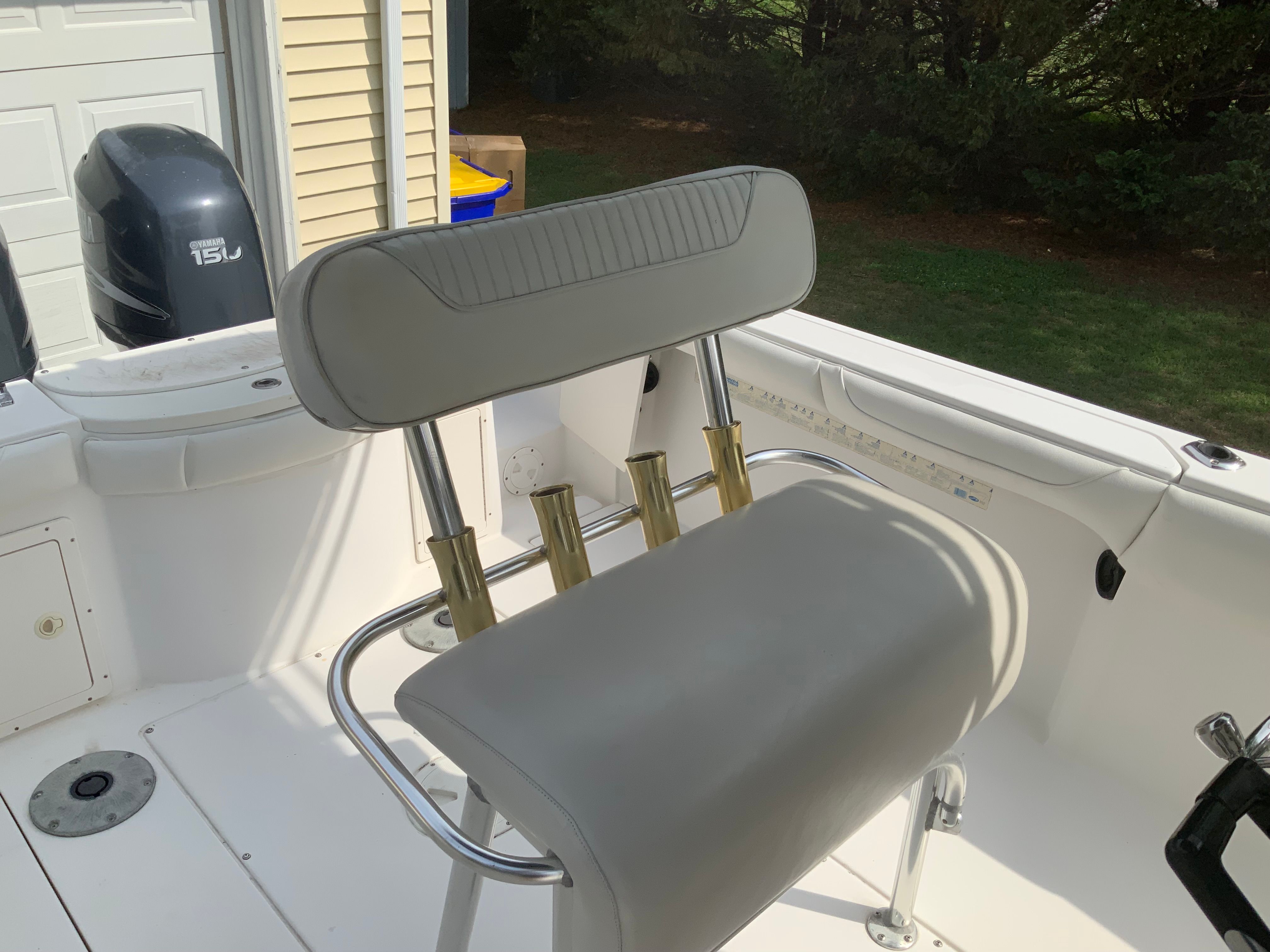The image shows the seating area of a 2006 Seaswirl Striper 26 boat with fishing rod holders.