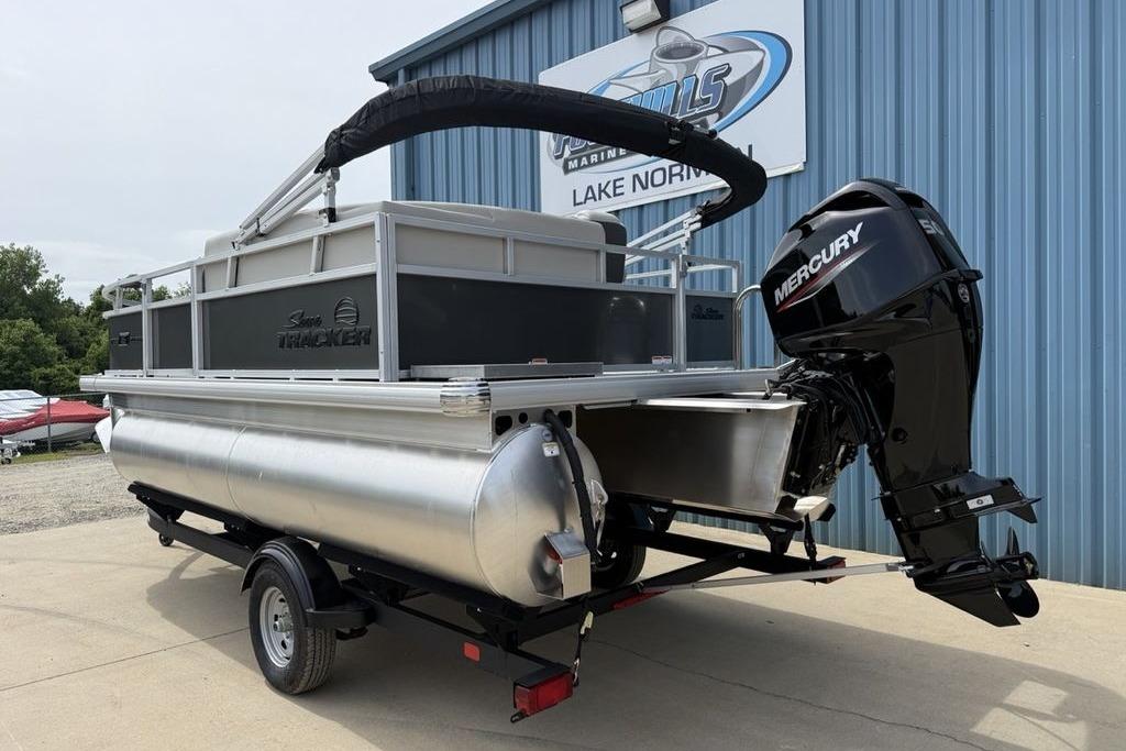 2026 Sun Tracker Bass Buggy 16 XL Select pontoon boat with Mercury outboard motor.