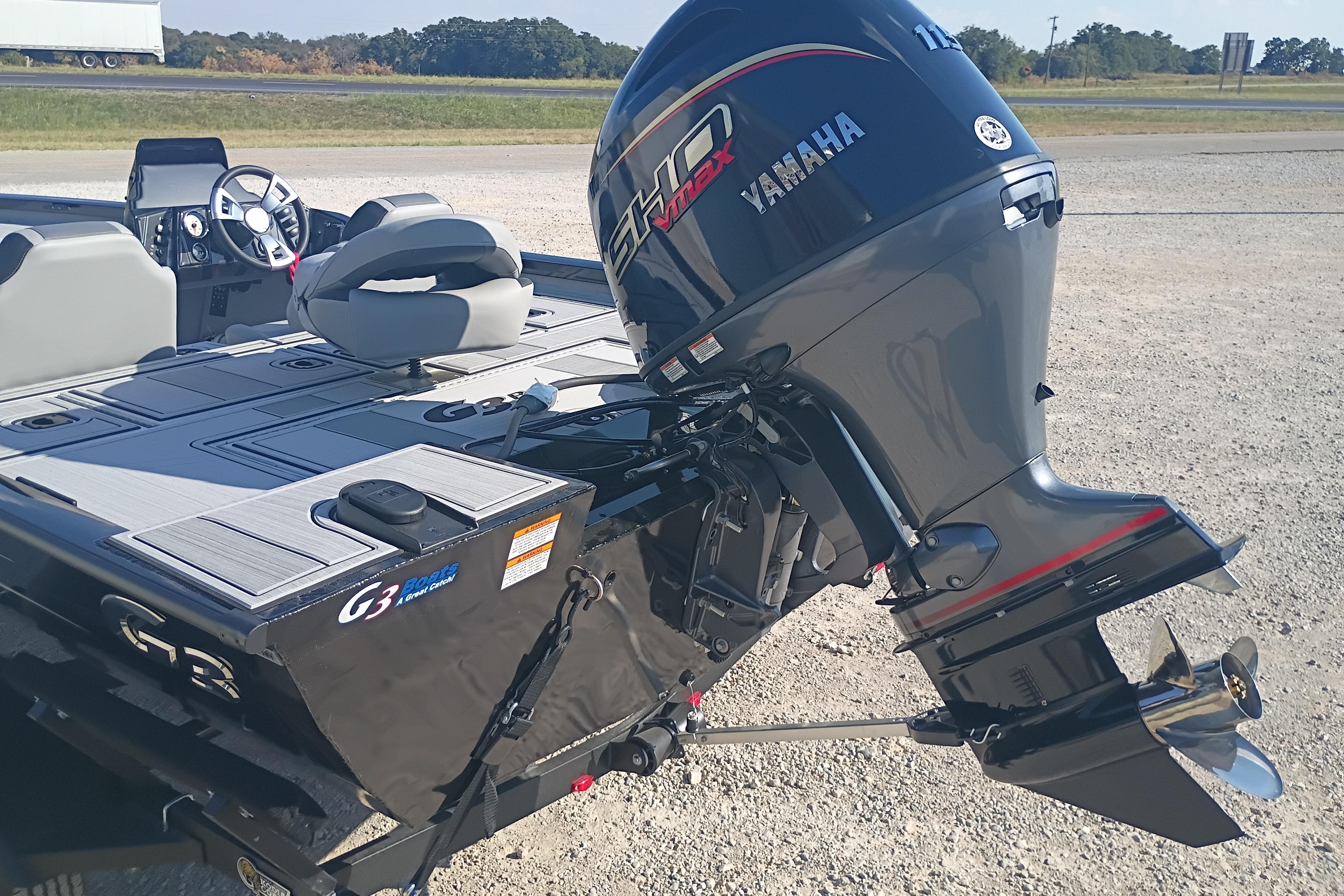 2026 G3 1810SE boat with Yamaha outboard motor, parked on gravel.