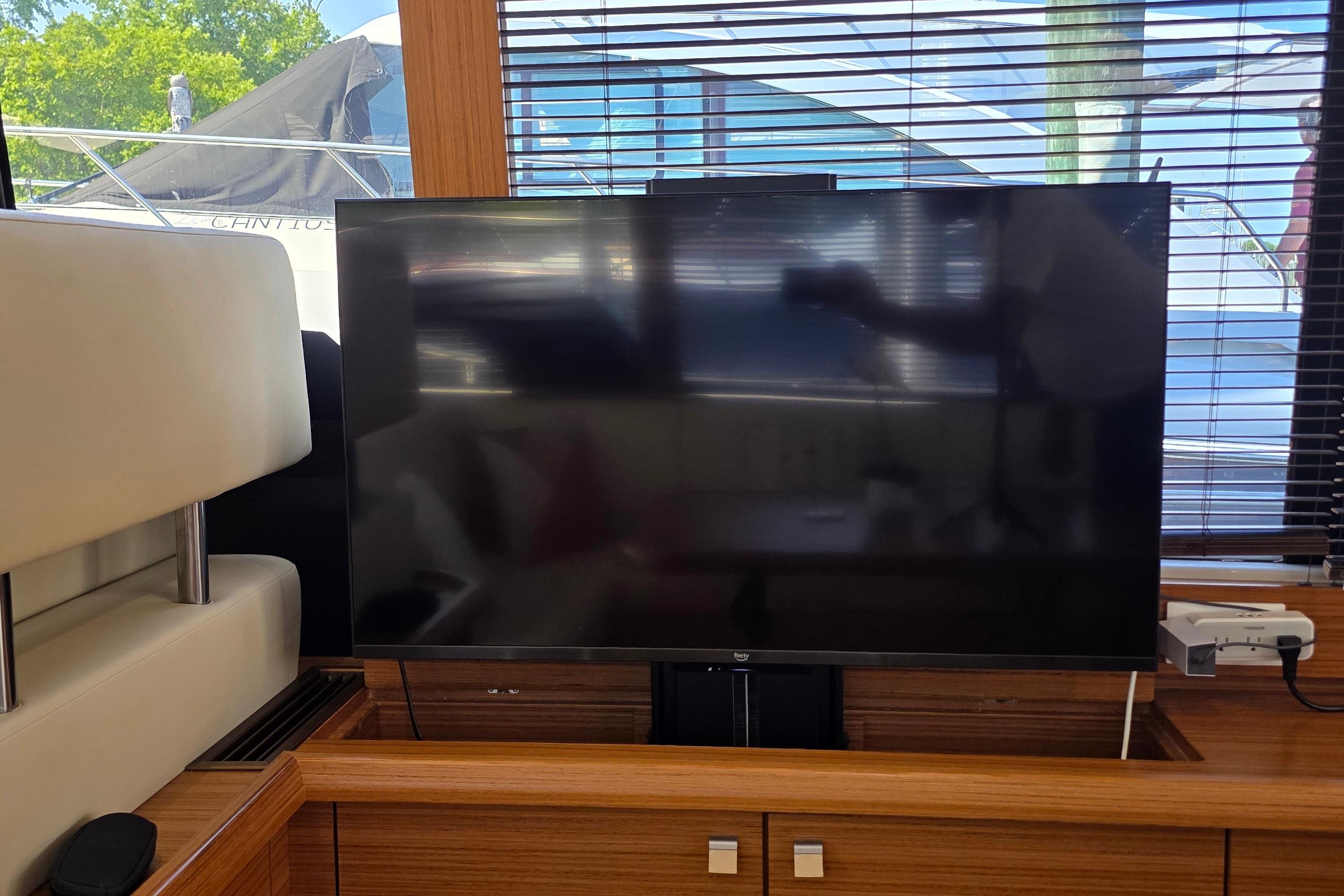 Interior of 2023 Greenline 40 yacht featuring a modern flat-screen TV setup.