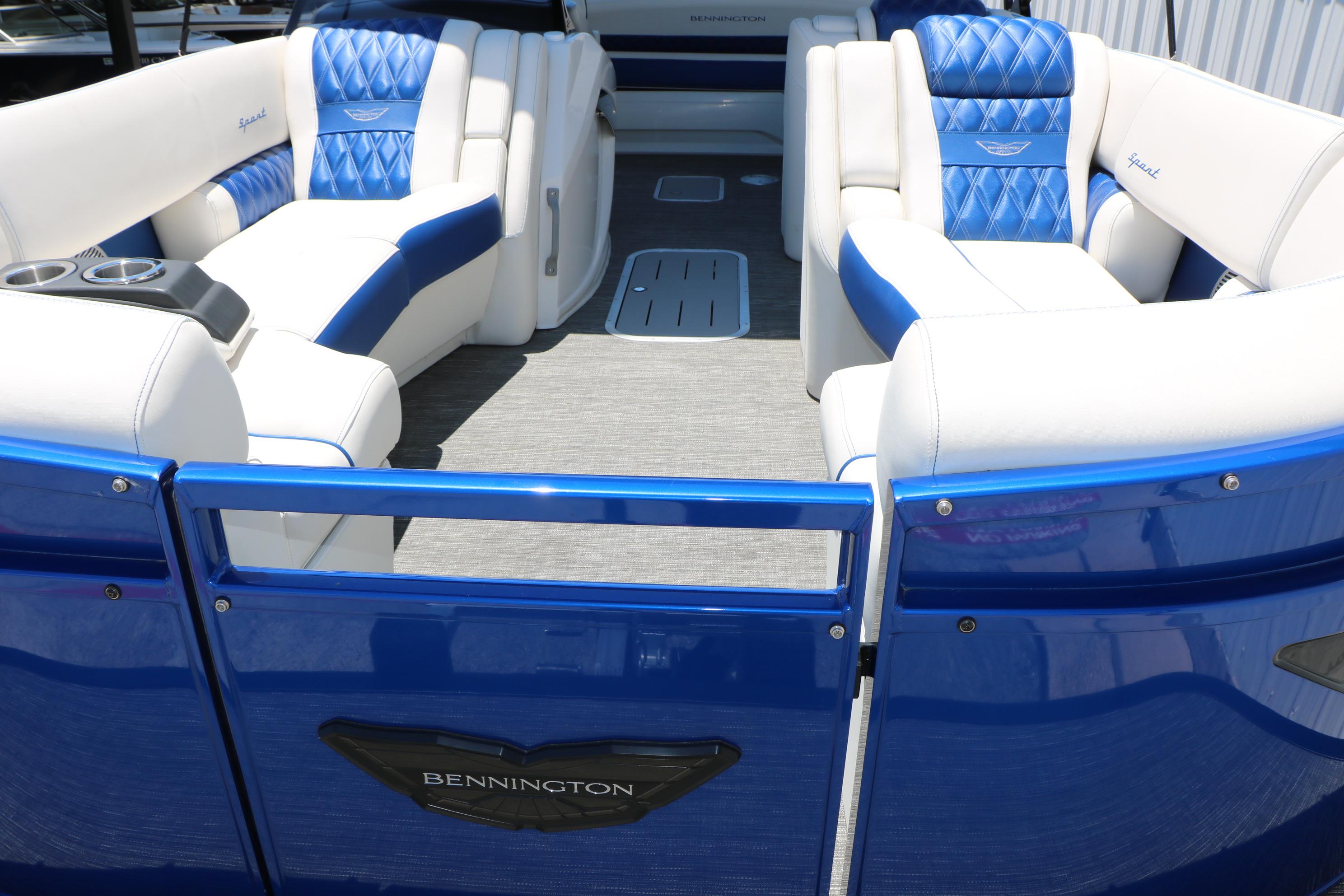 2024 Bennington 23 RX Swingback pontoon boat with luxurious blue and white seating.