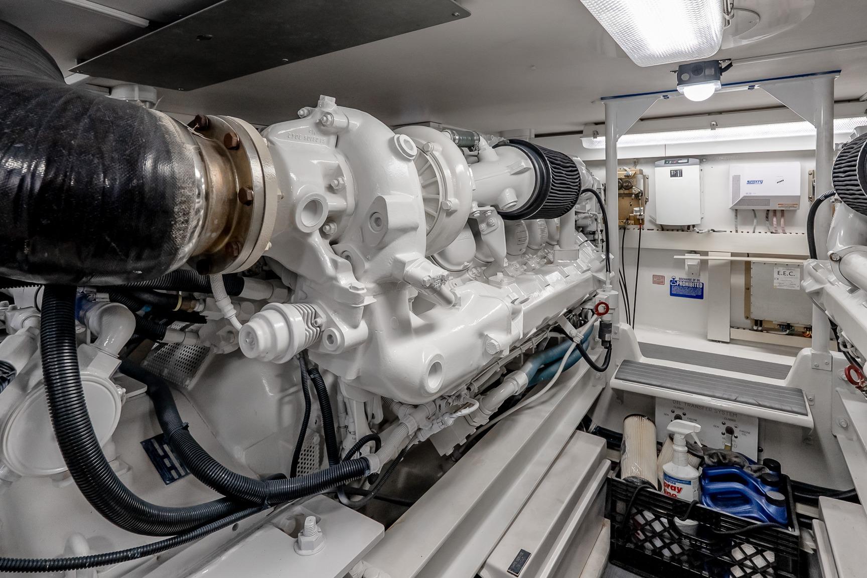 Engine room of a 2000 Viking 50' Convertible yacht, showcasing machinery and equipment.
