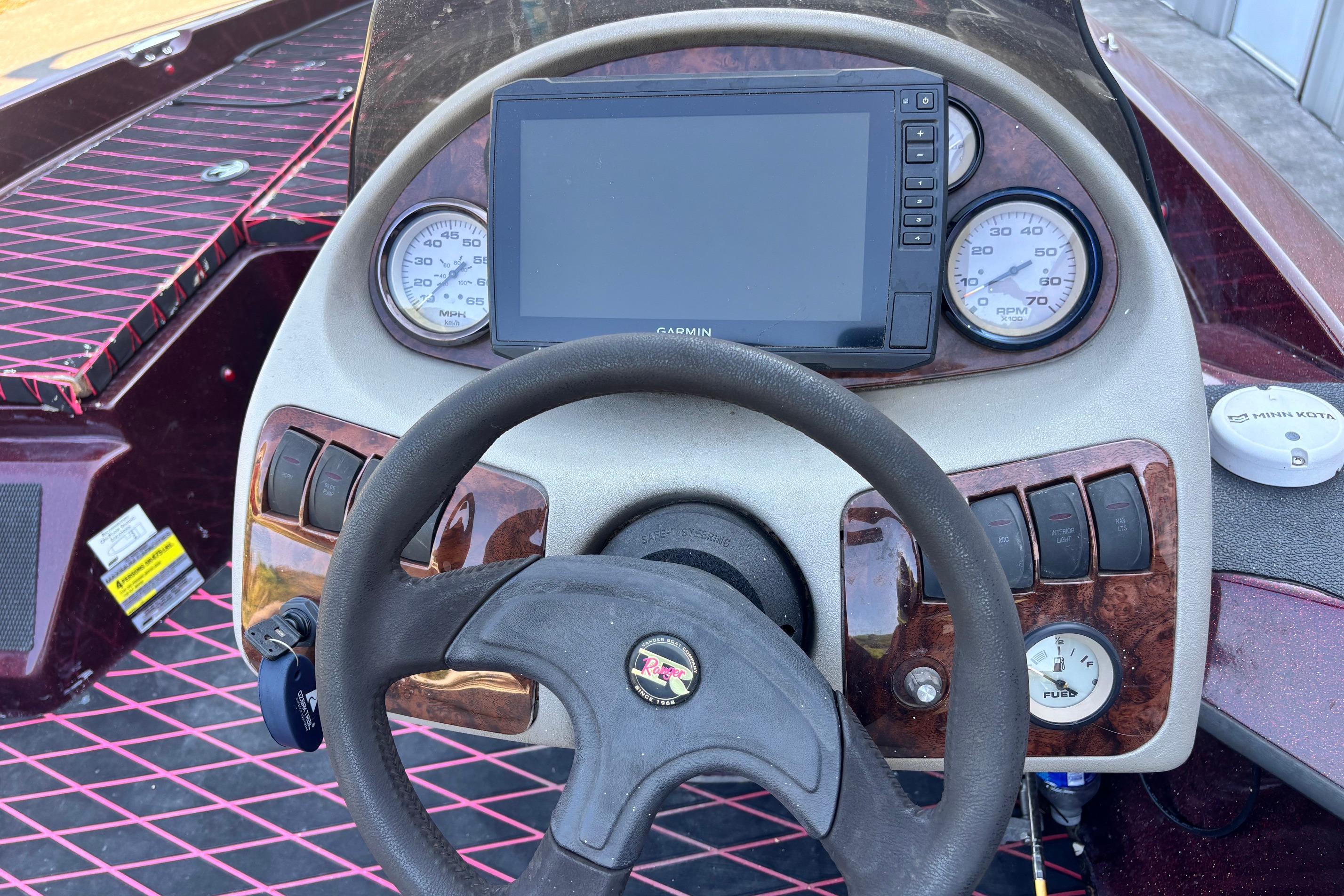 Dashboard of a 2004 Ranger 175SVS boat with Garmin display and gauges.