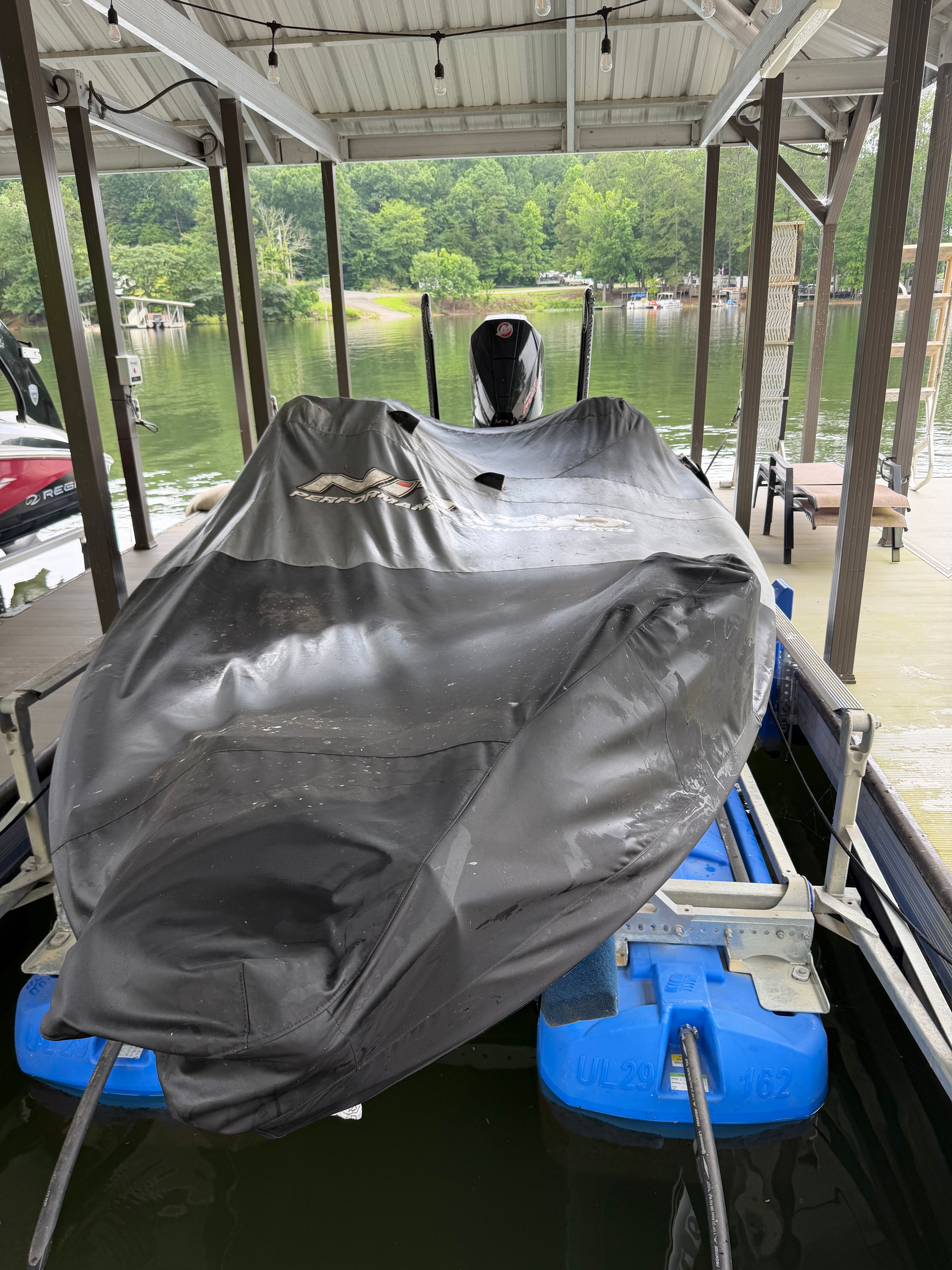 2024 Tracker Z19 covered on a boat lift.